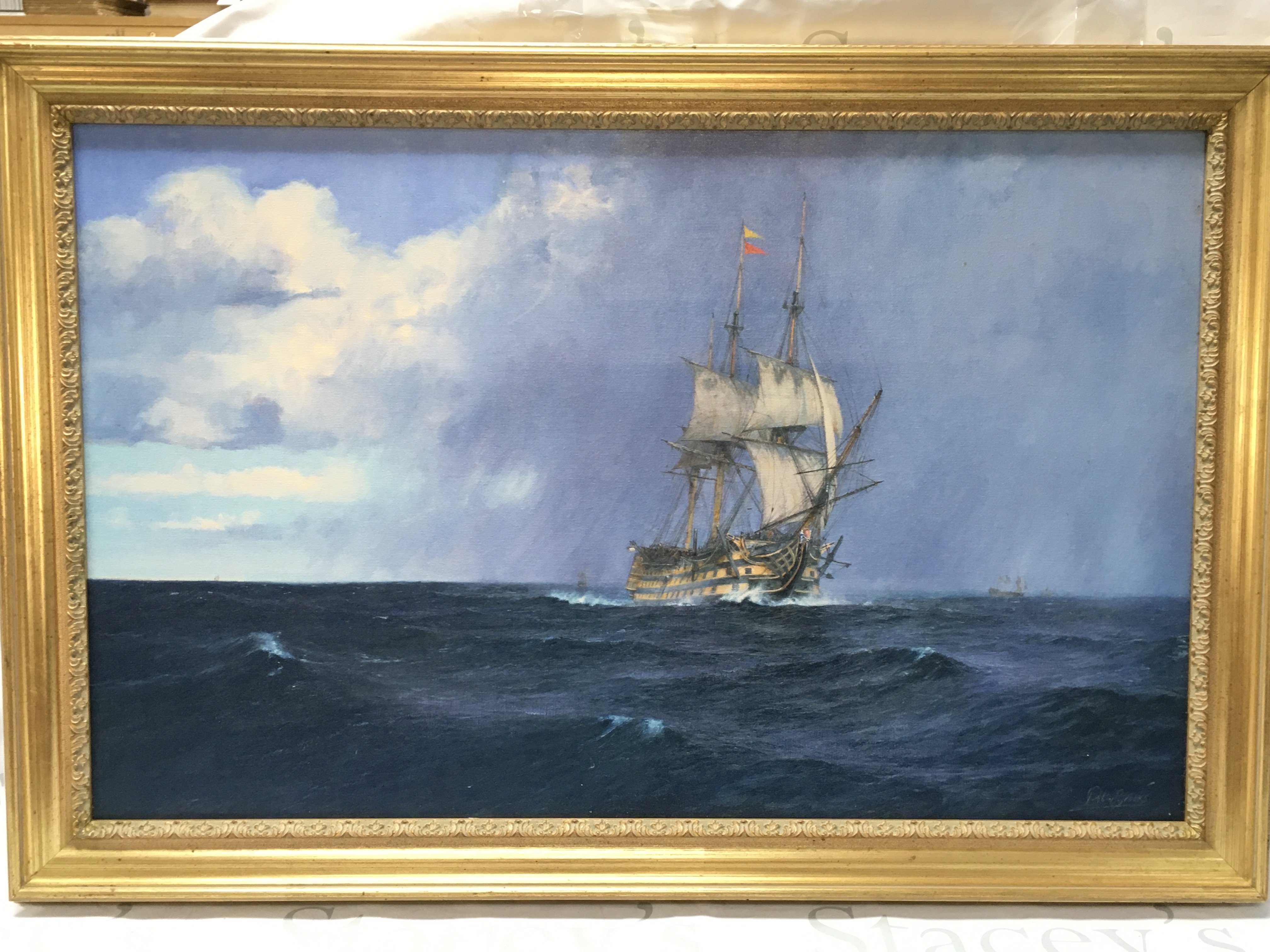 A 20th century Oil on canvas painting by Robin Brooks, a clipper ship at sea. Frame dimensions 58x85cm This lot cannot be posted
