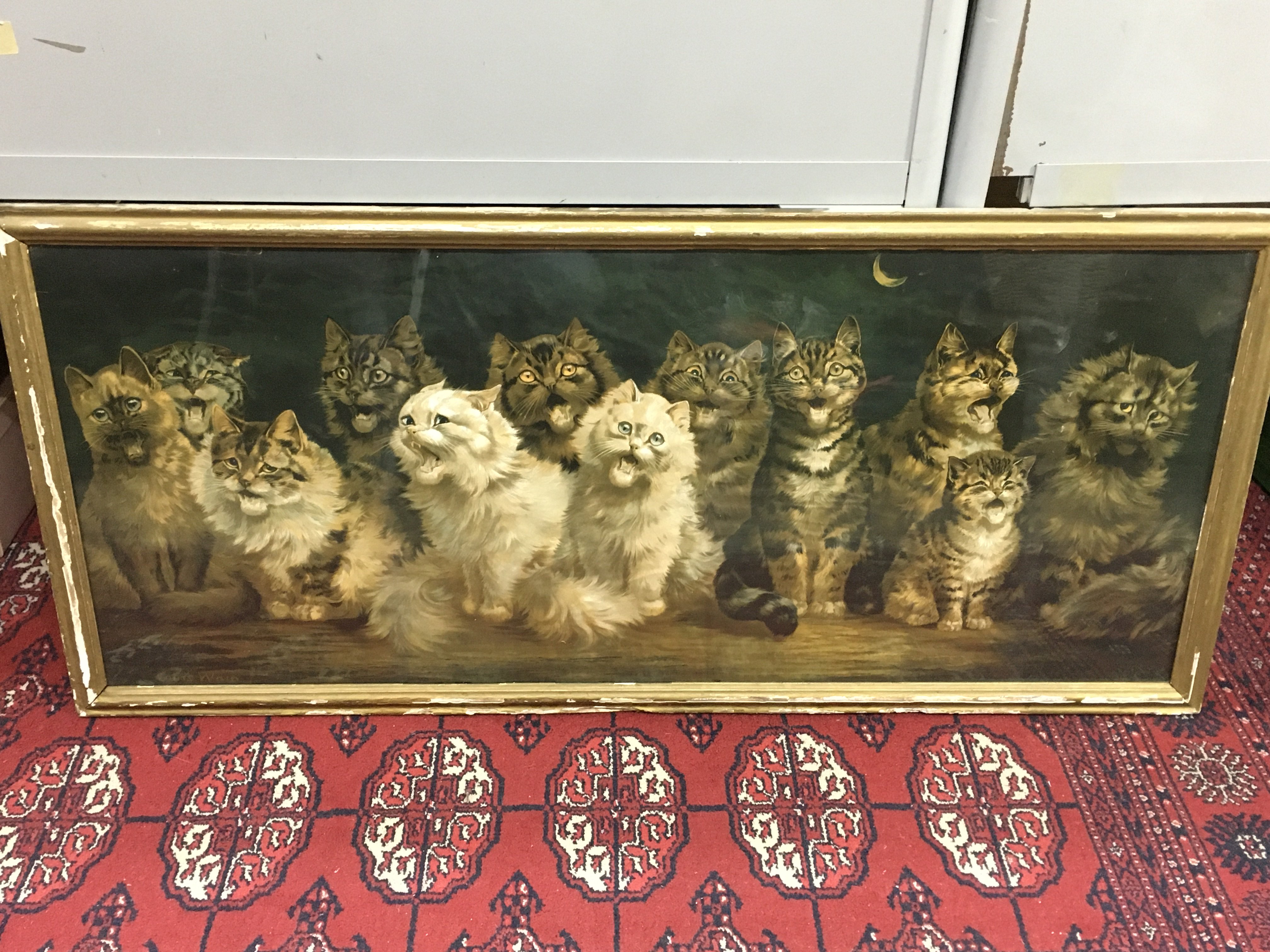 A framed Louis Wain (1860-1939) Cats chorus by moonlight print. Frame dimensions 102x46cm