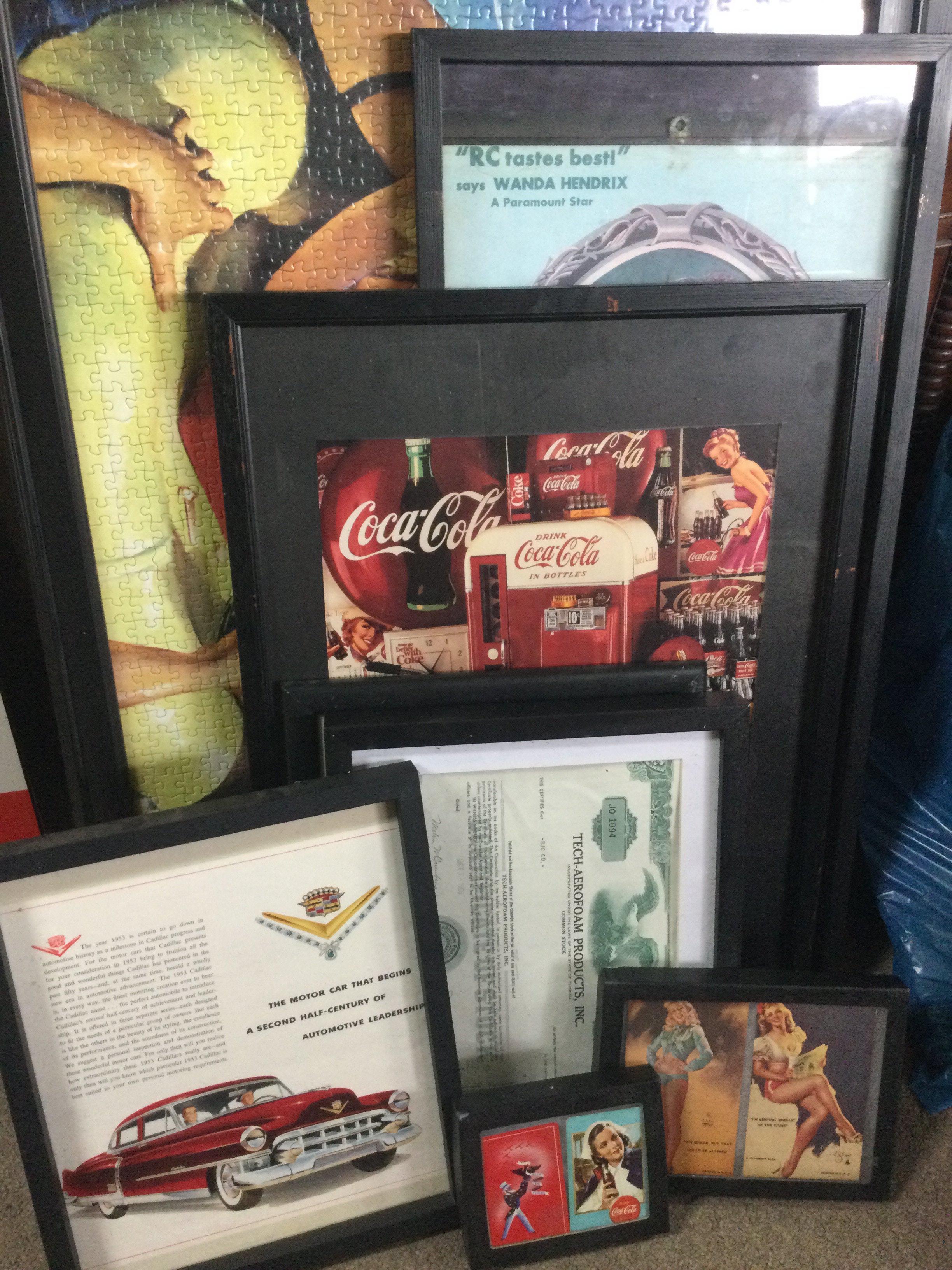 A large collection of various vintage pictures including a framed Cadillac advertisement , Whitmans sampler chocolate and confections advert, Coca Cola advert, Royal crown cola, framed Coca Cola puzzle.this lot cannot be posted