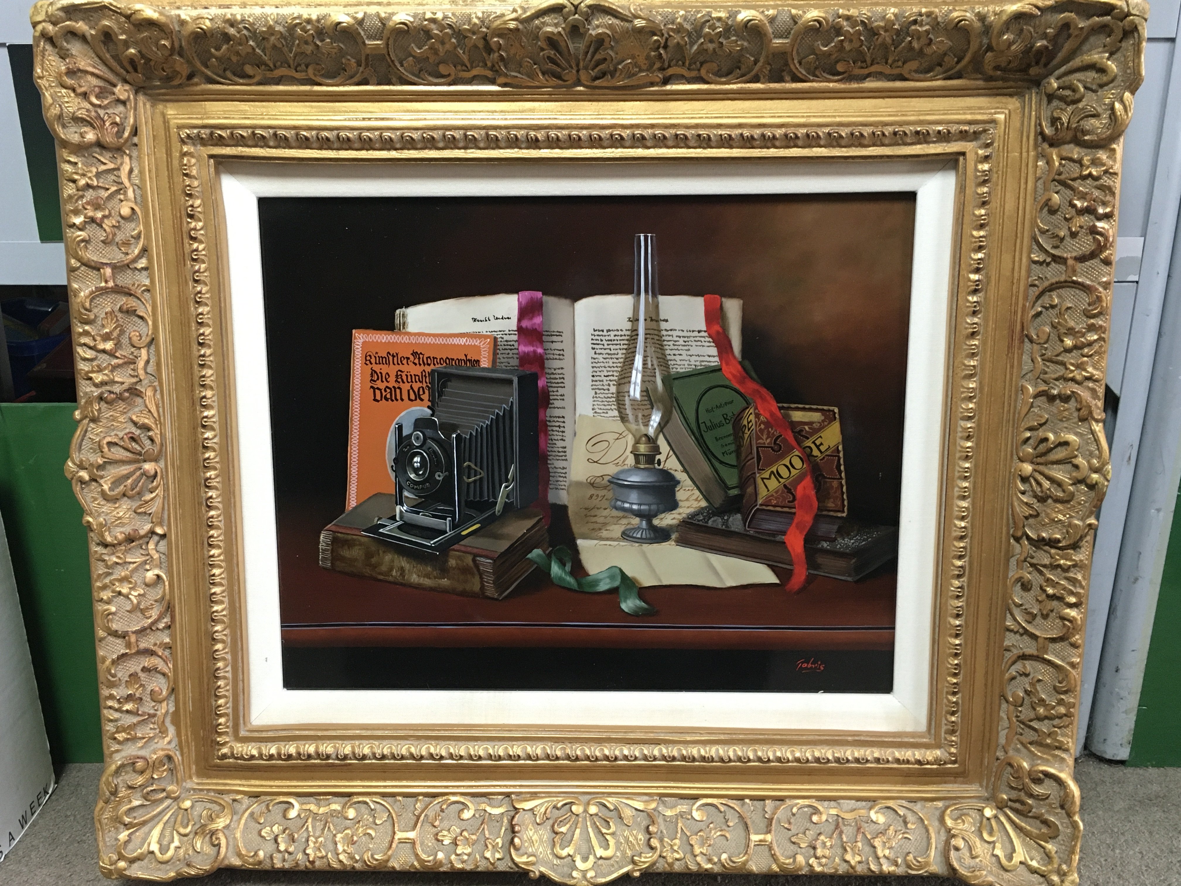 a 20th century gilt framed still life oil painting by T.Gabris, depicting German related items. Frame dimensions 78x70cm