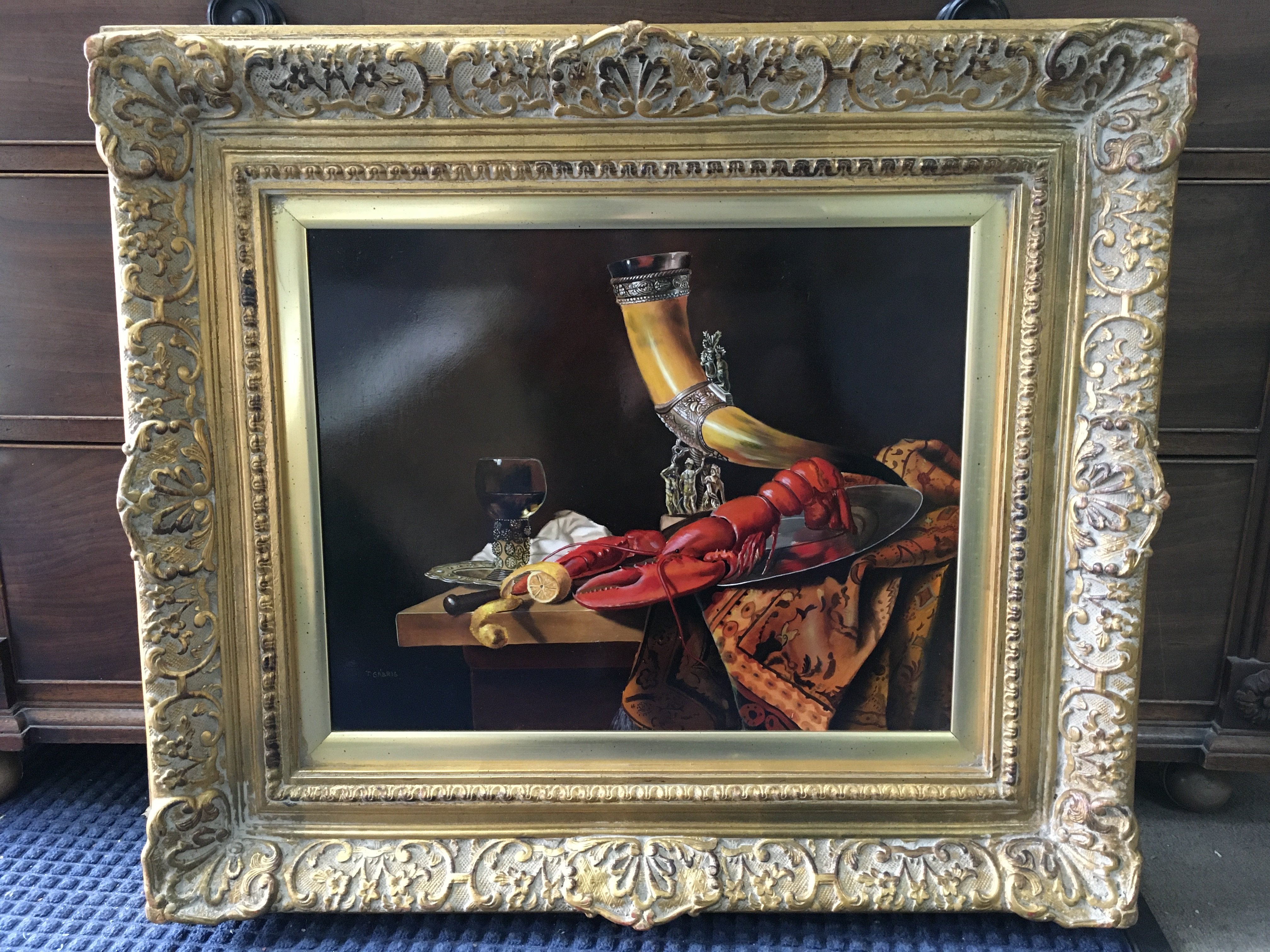 a 20th century gilt framed still life oil painting by T.Gabris, after 17th century Dutch artist W. Kalf Still life with lobster, drinking horn and glasses. Frame dimensions 78x68cm