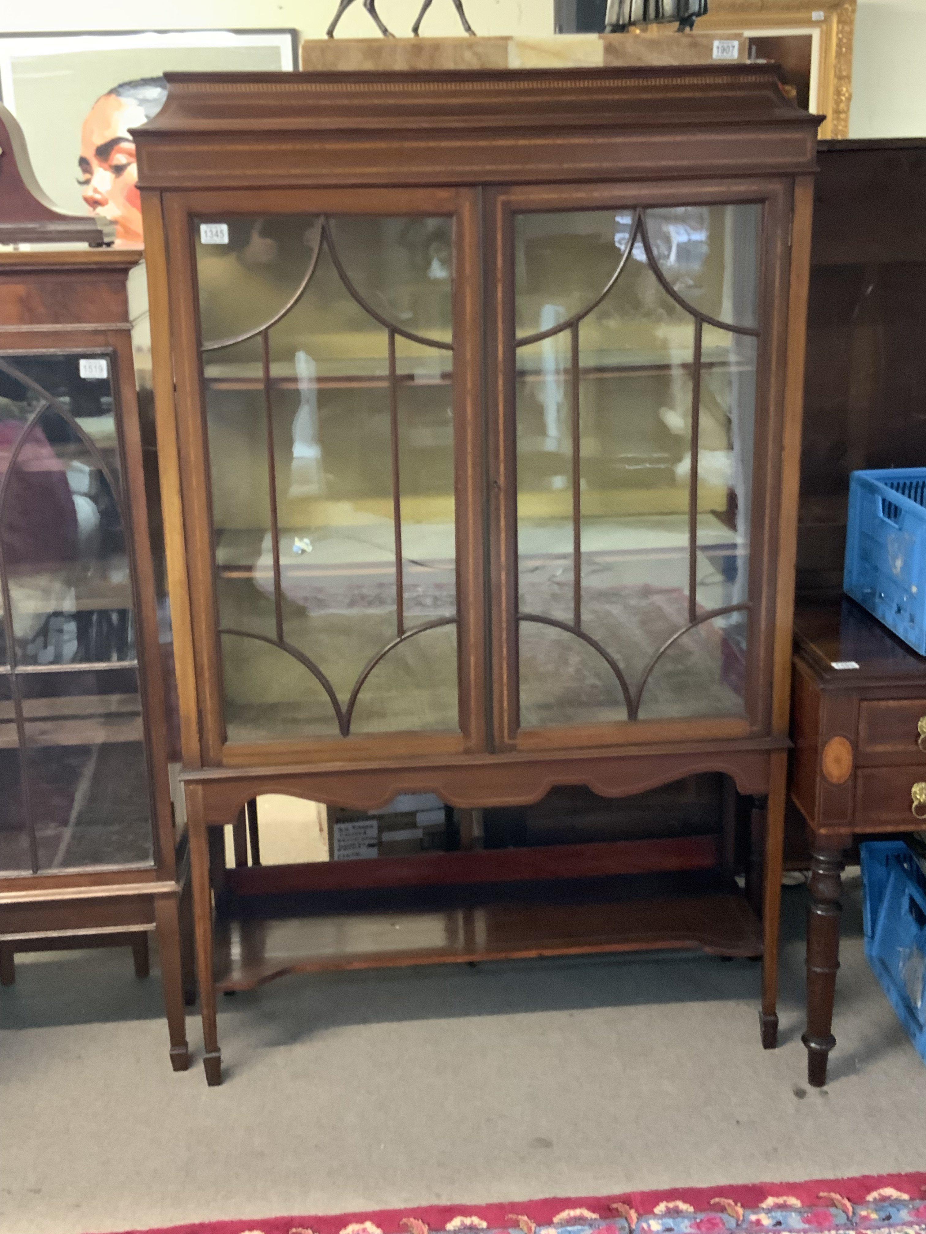 An Edwardian display cabinet. 166cm x 101cm x 34cm