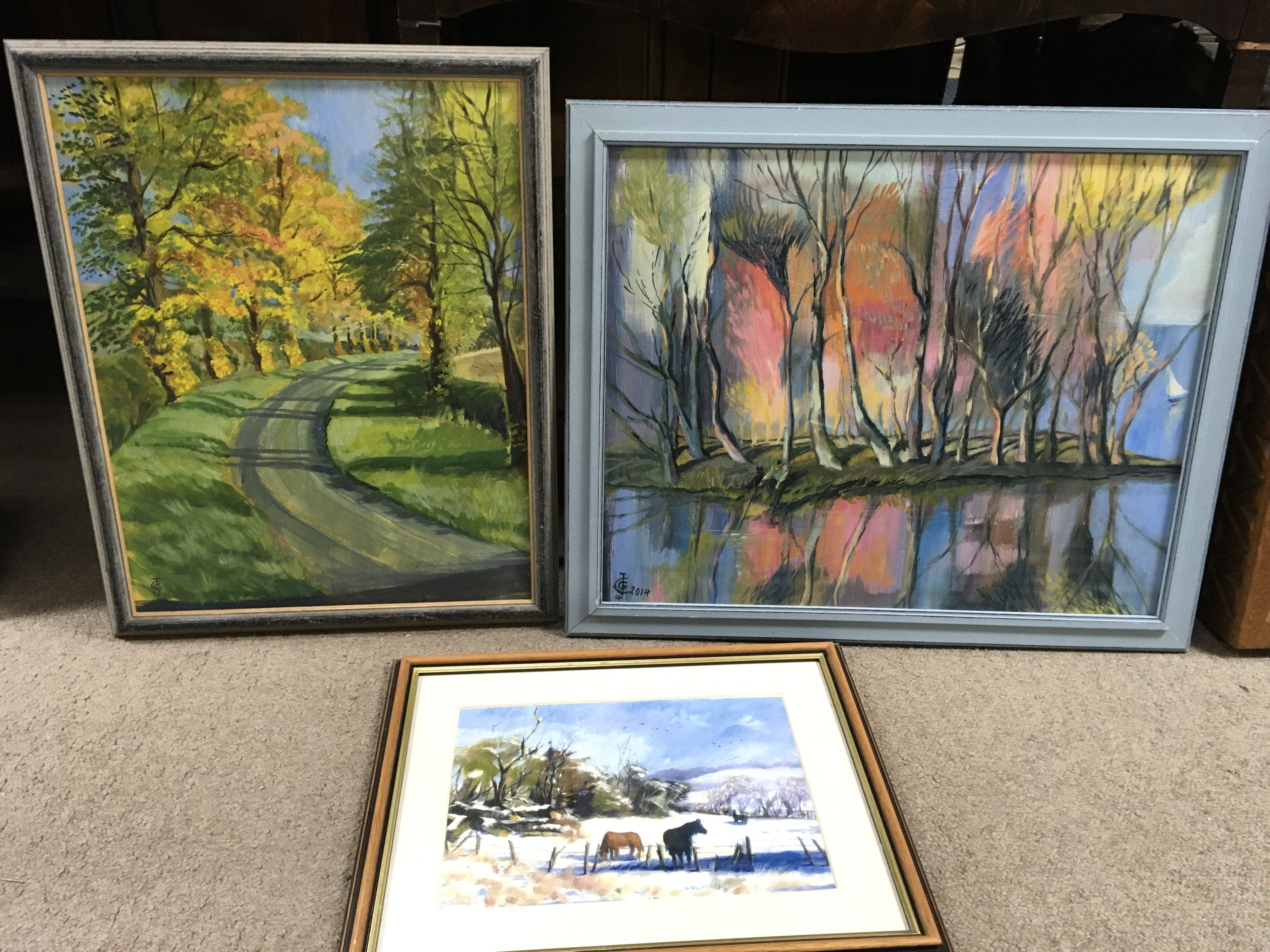 Two 20th century Joanna Crawford framed oil/pastel paintings of abstract style rural scenes and one horses in a field print. No reserve This lot cannot be posted