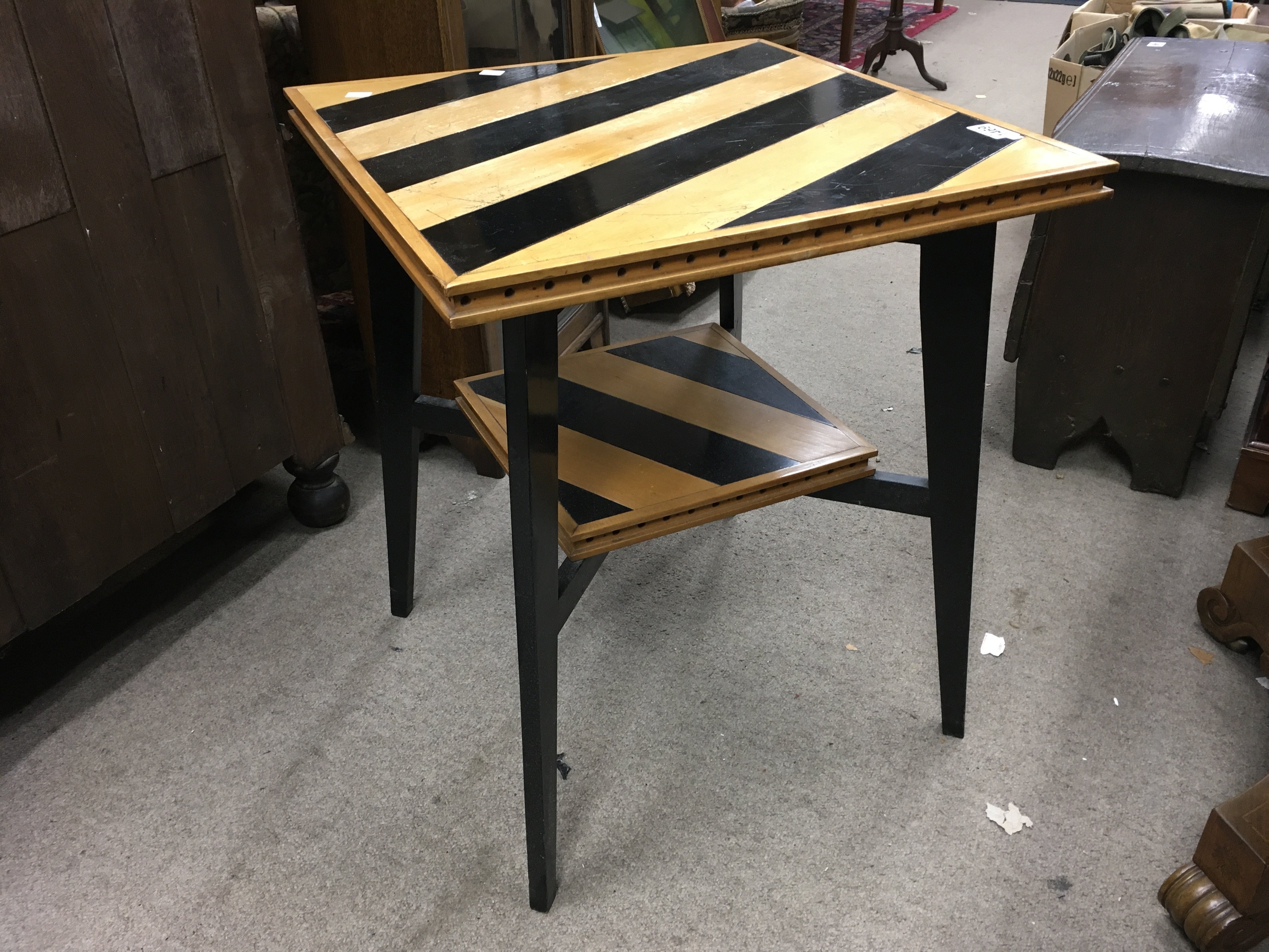 An Art Deco occasional table, the rectangular striped top above square tapering legs, United by an under tier. Attributed to Charles Dudouyt. 62cm x 53cm