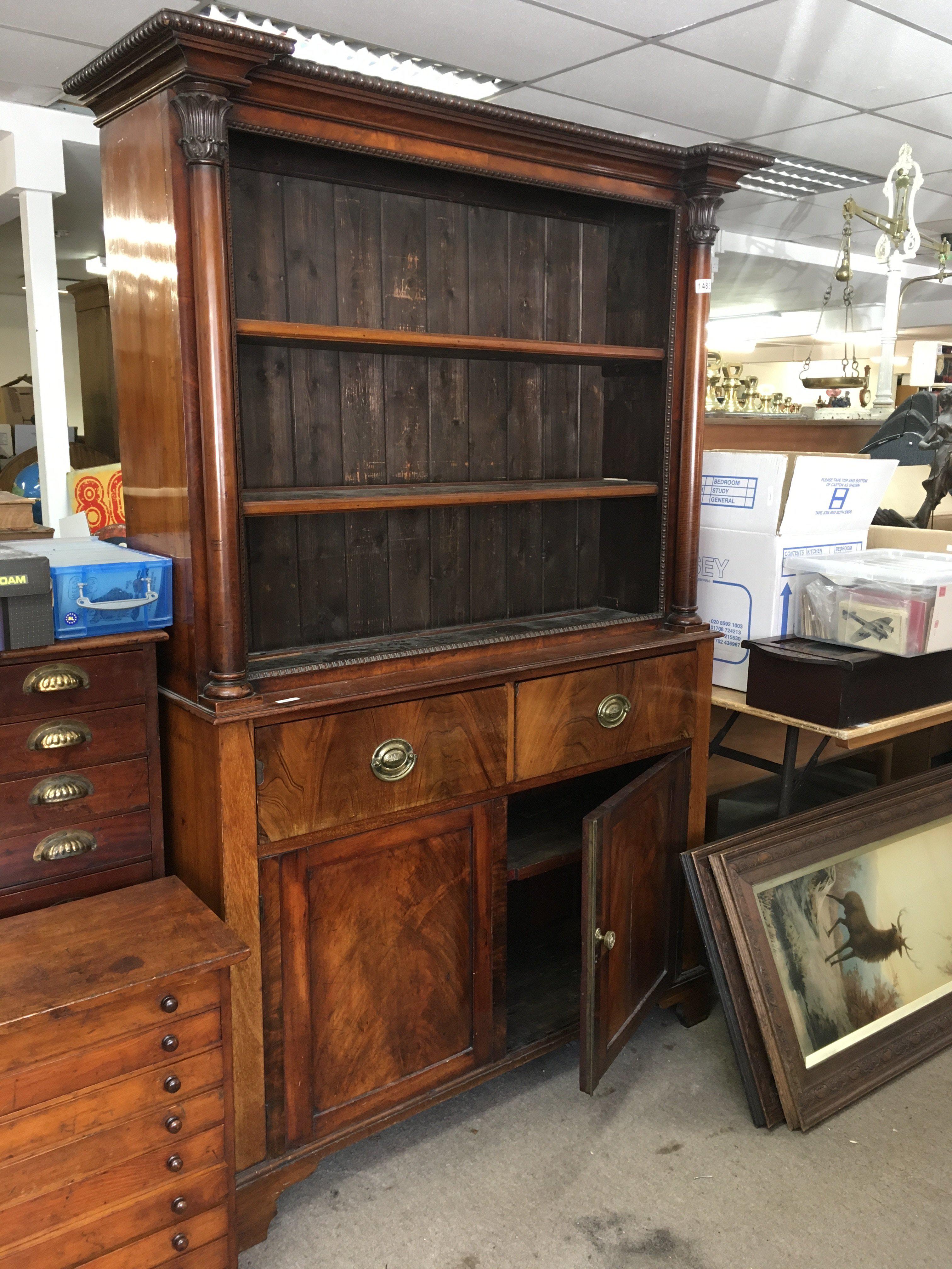 A Victorian open bookcase above two drawers and cupboards under. On bracket feet. NO RESERVE
