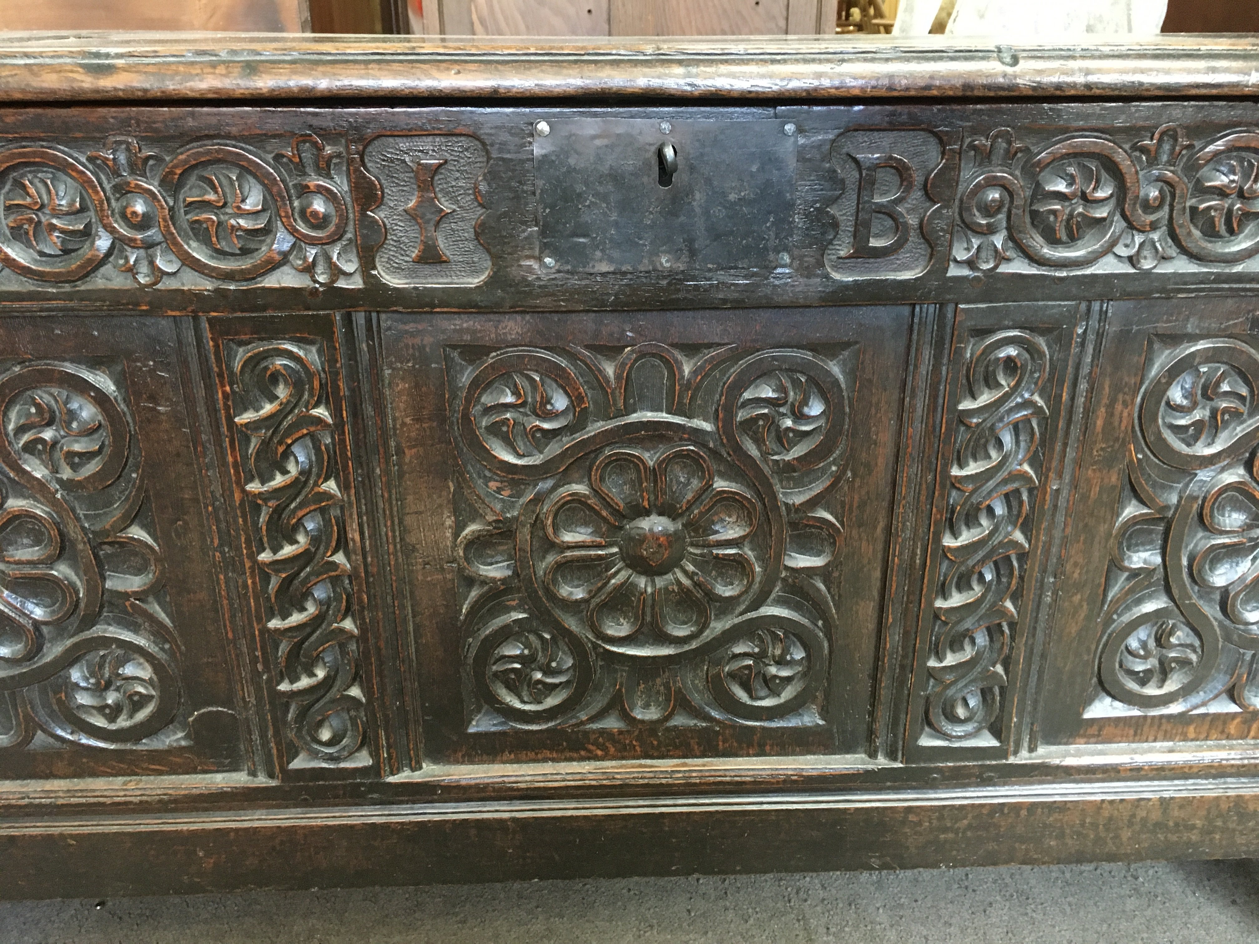 A large oak blanket box, the hinged lid above a carved panel front. 58cm x 140cm x 75 cm. NO RESERVE