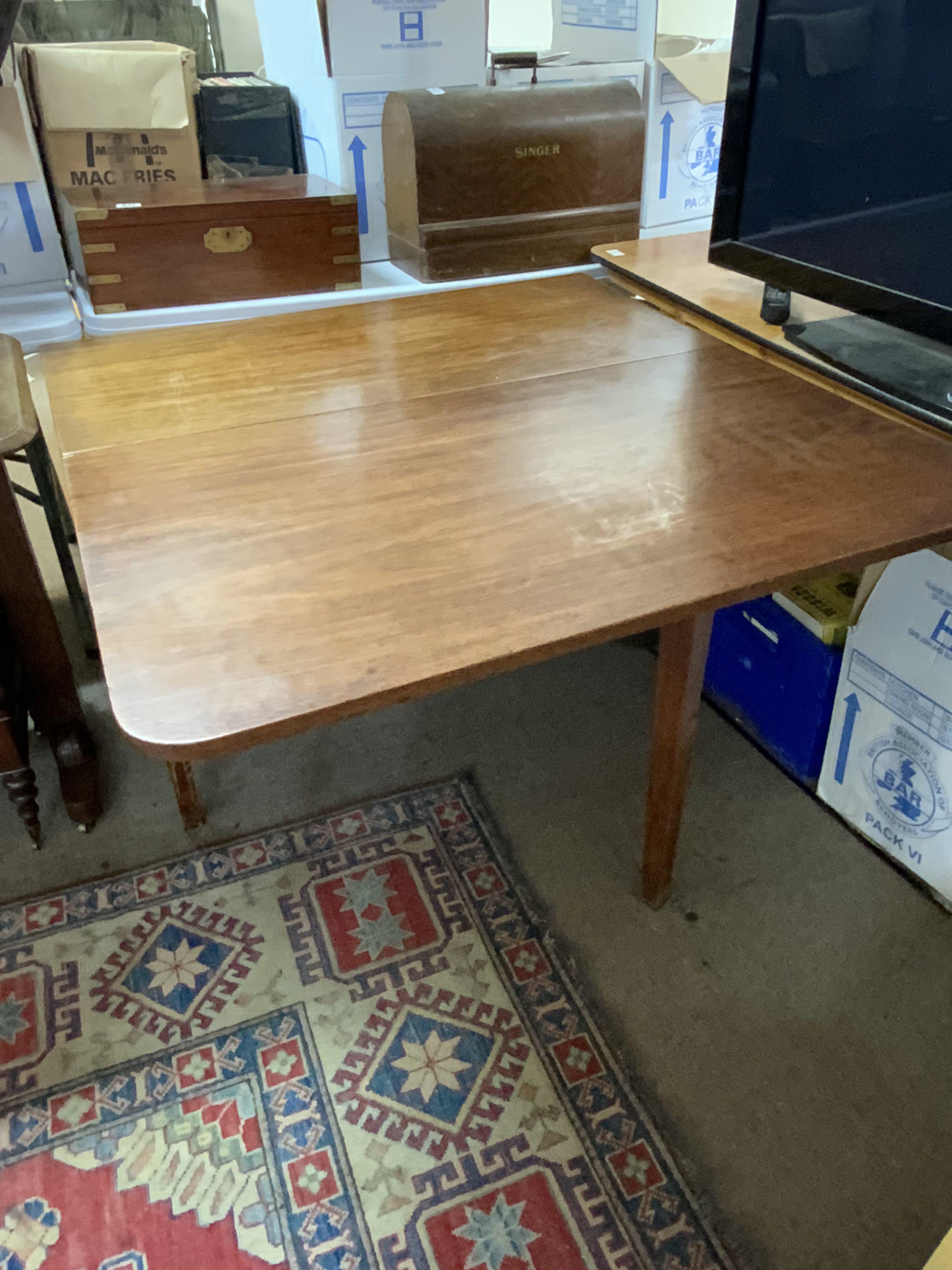 A large Victorian mahogany drop leaf dining table. 107cm x ext 186cm. NO RESERVE