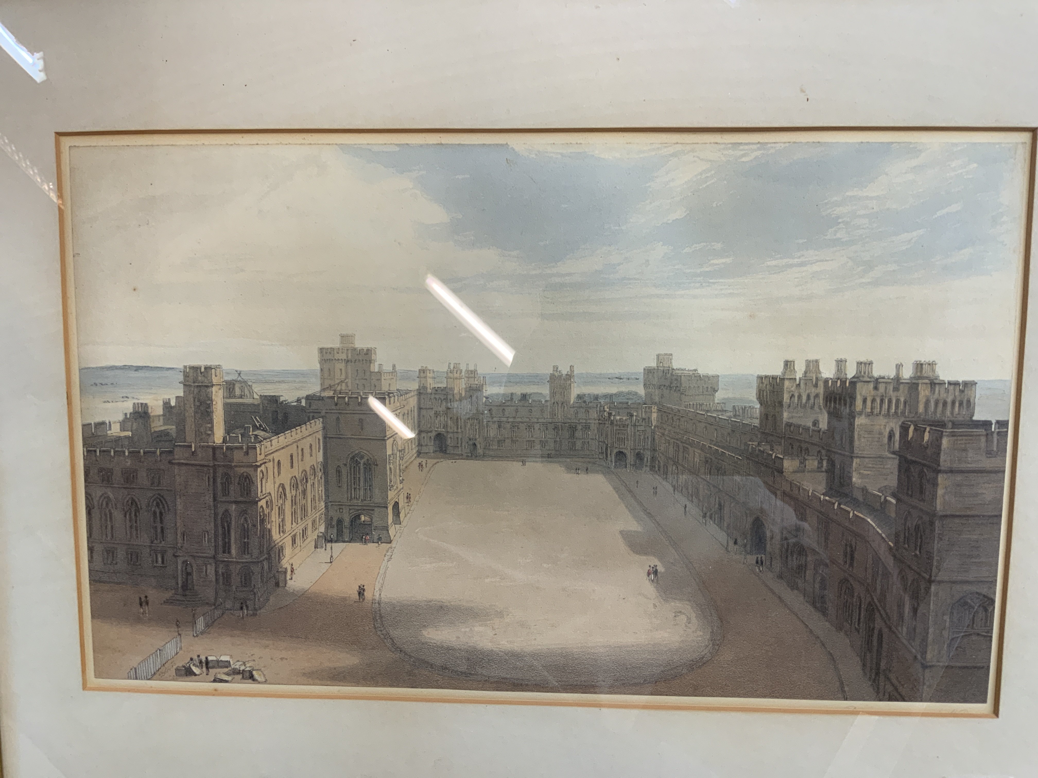 An antique wood effect mirror together with a coloured aquatint view of the quadrangle at Windsor castle. NO RESERVE