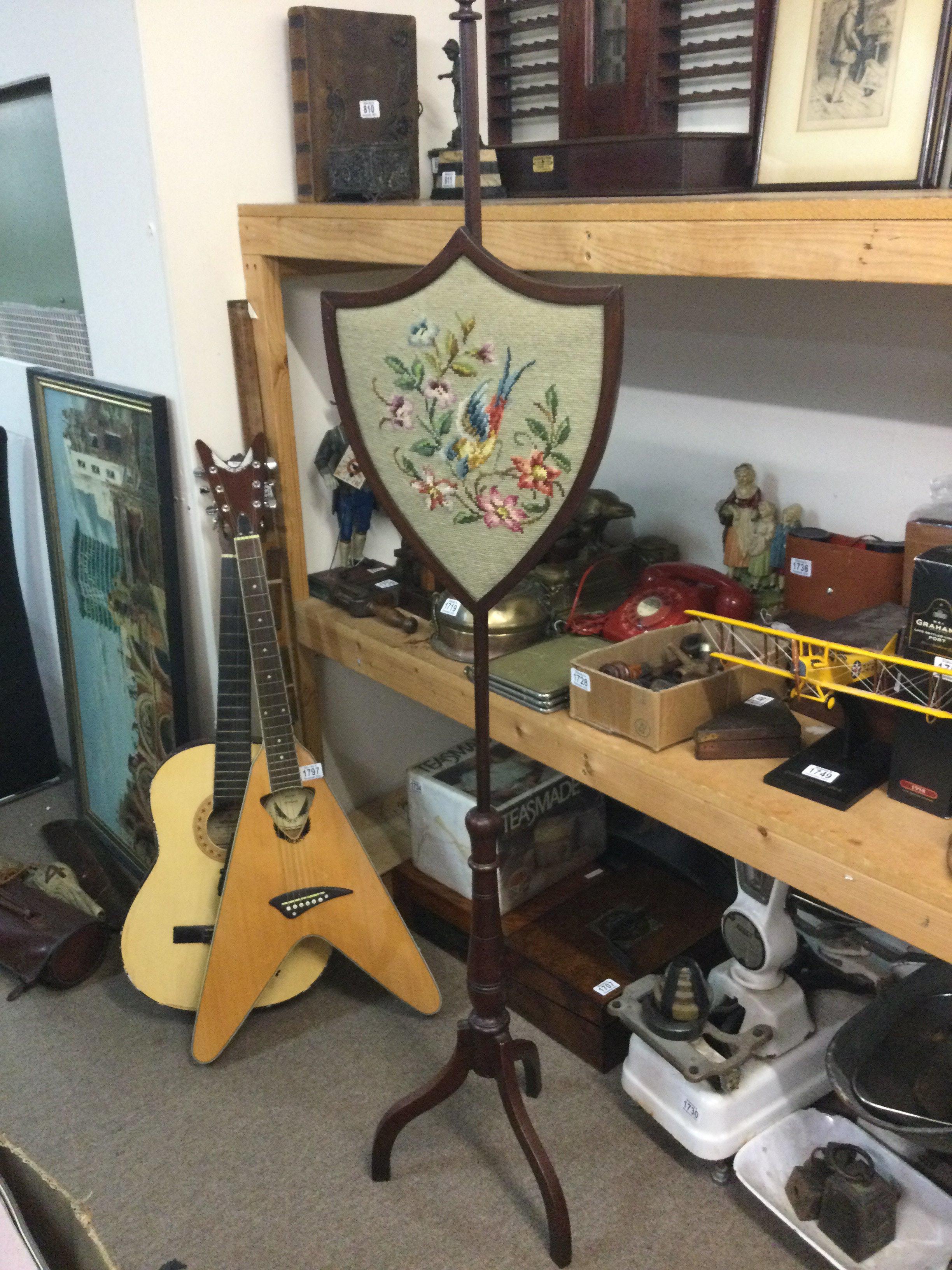 A Victorian pole screen 163cm tall.