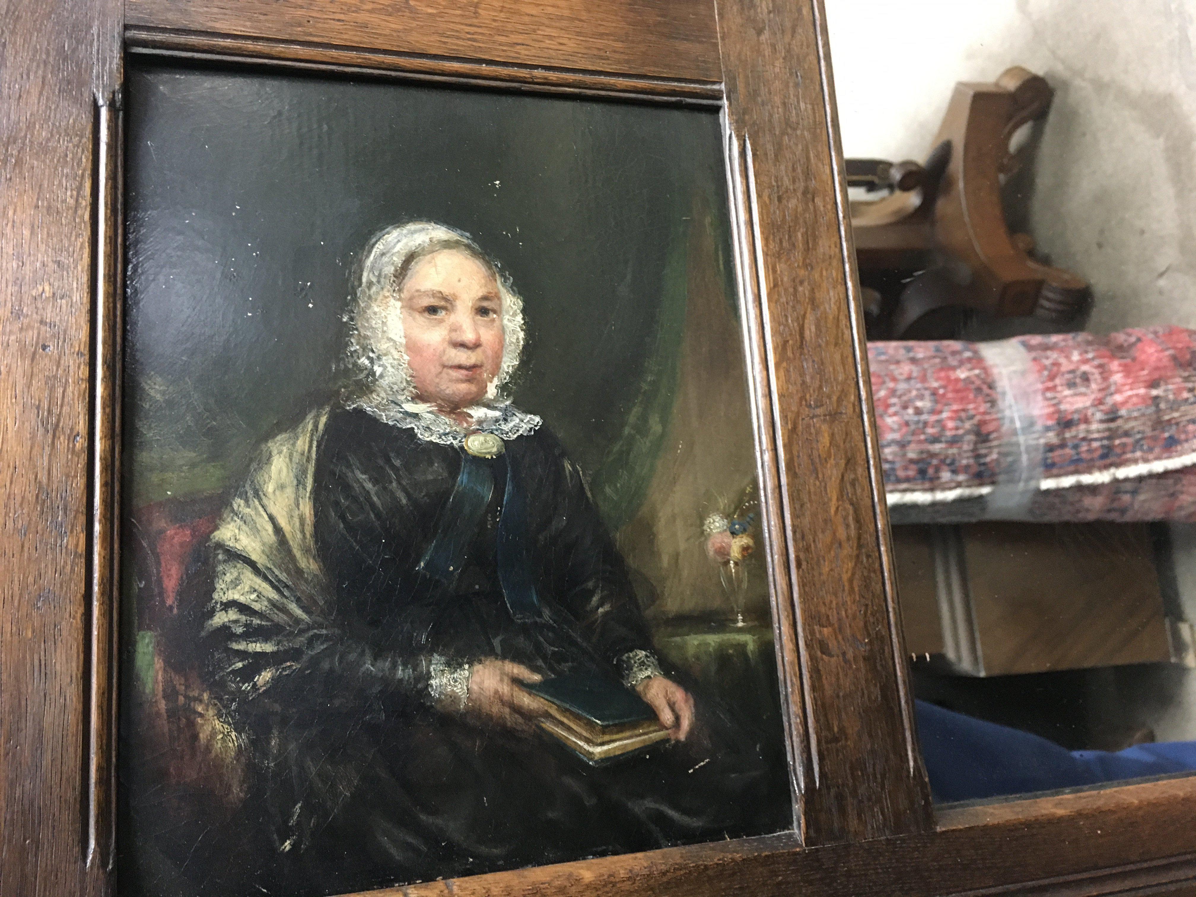 A oak framed mirror inset with two oil paintings on board 115 cm x52 cm