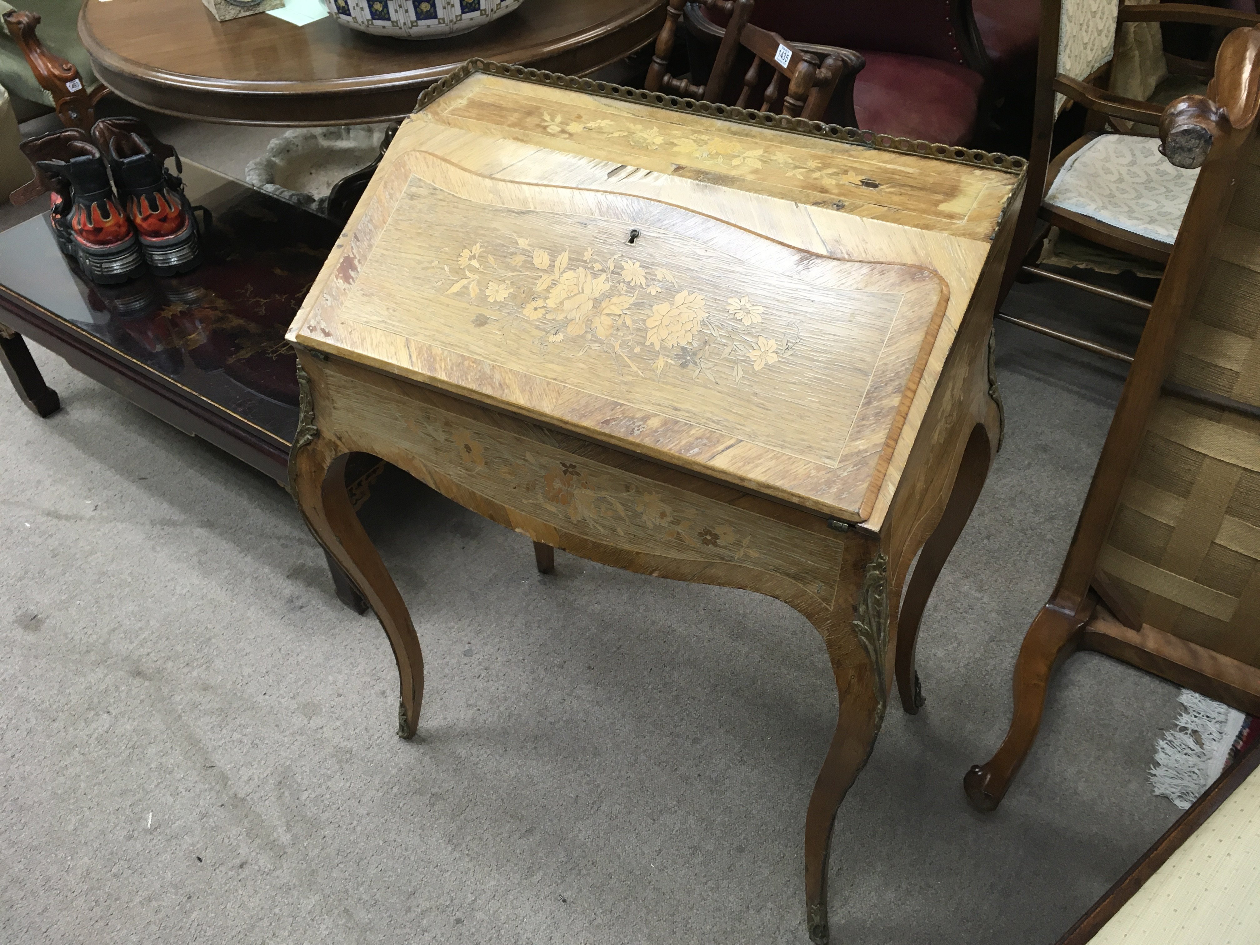 An inlaid french style bureau 66cm wide 90cm tall 46cm deep