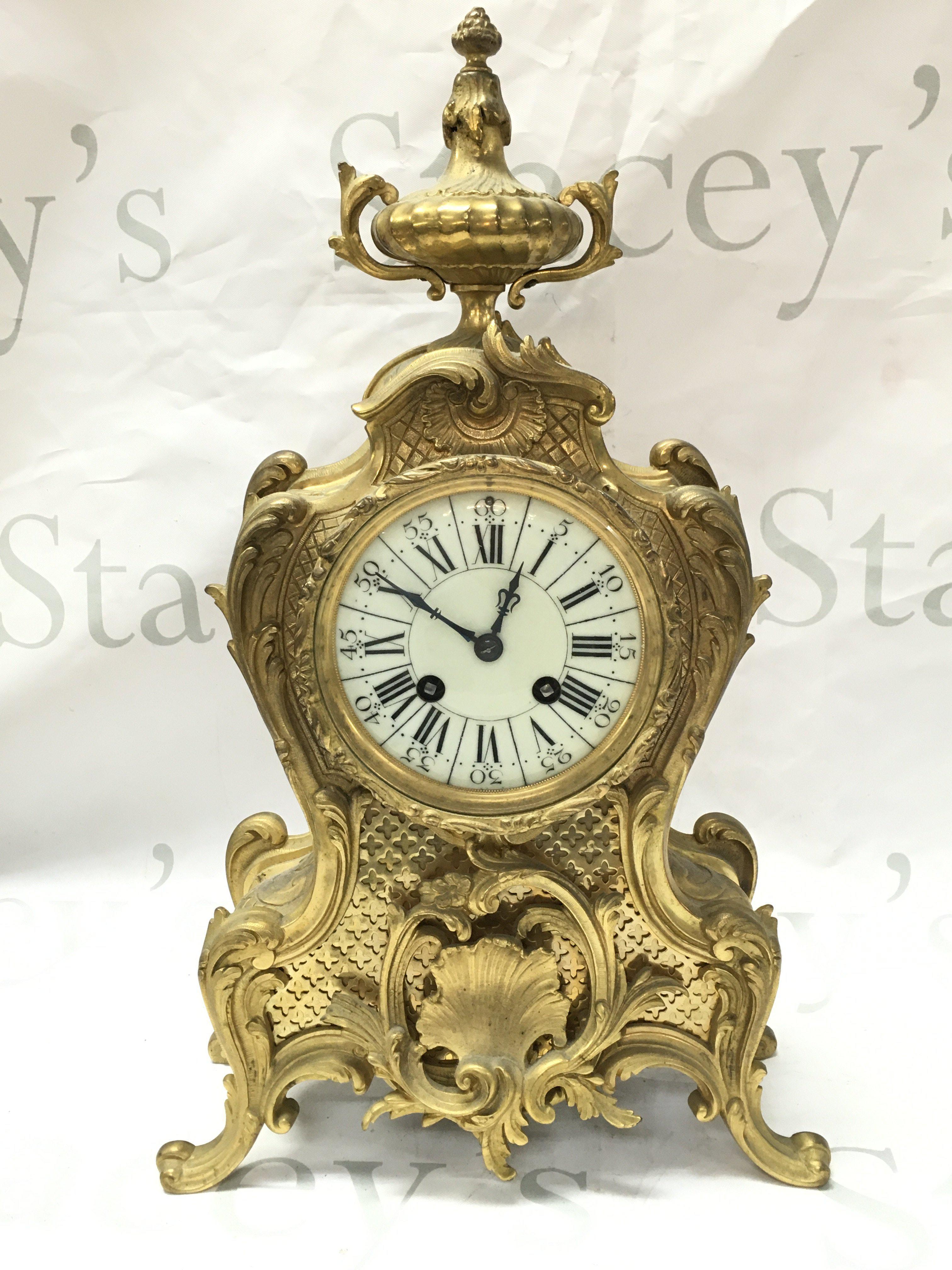 A French gilt Louis XV Style mantle clock 39cm tall. This lot cannot be posted