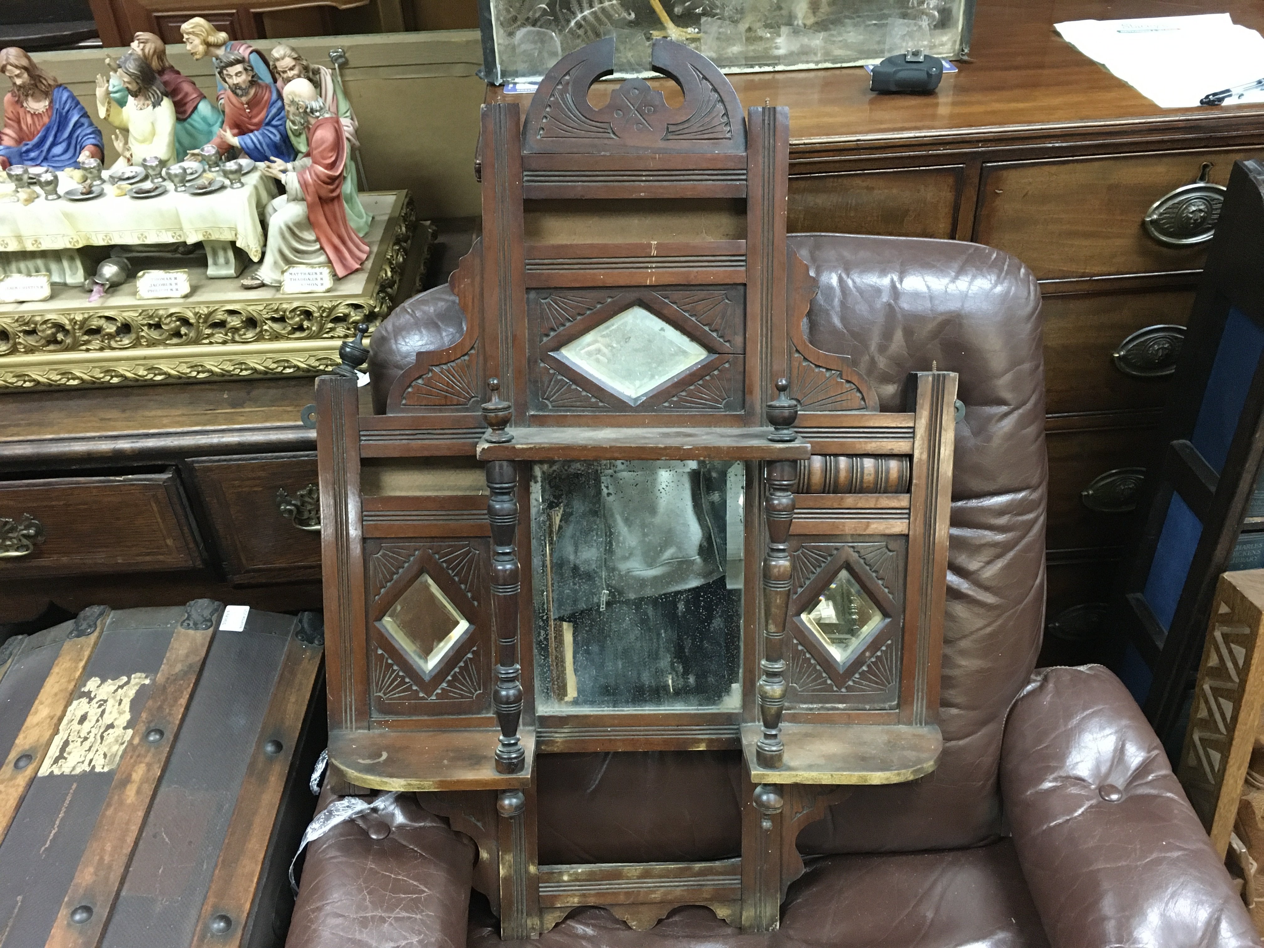A small over mantle oak carved design mirror , 57cm wide 82cm tall approximately