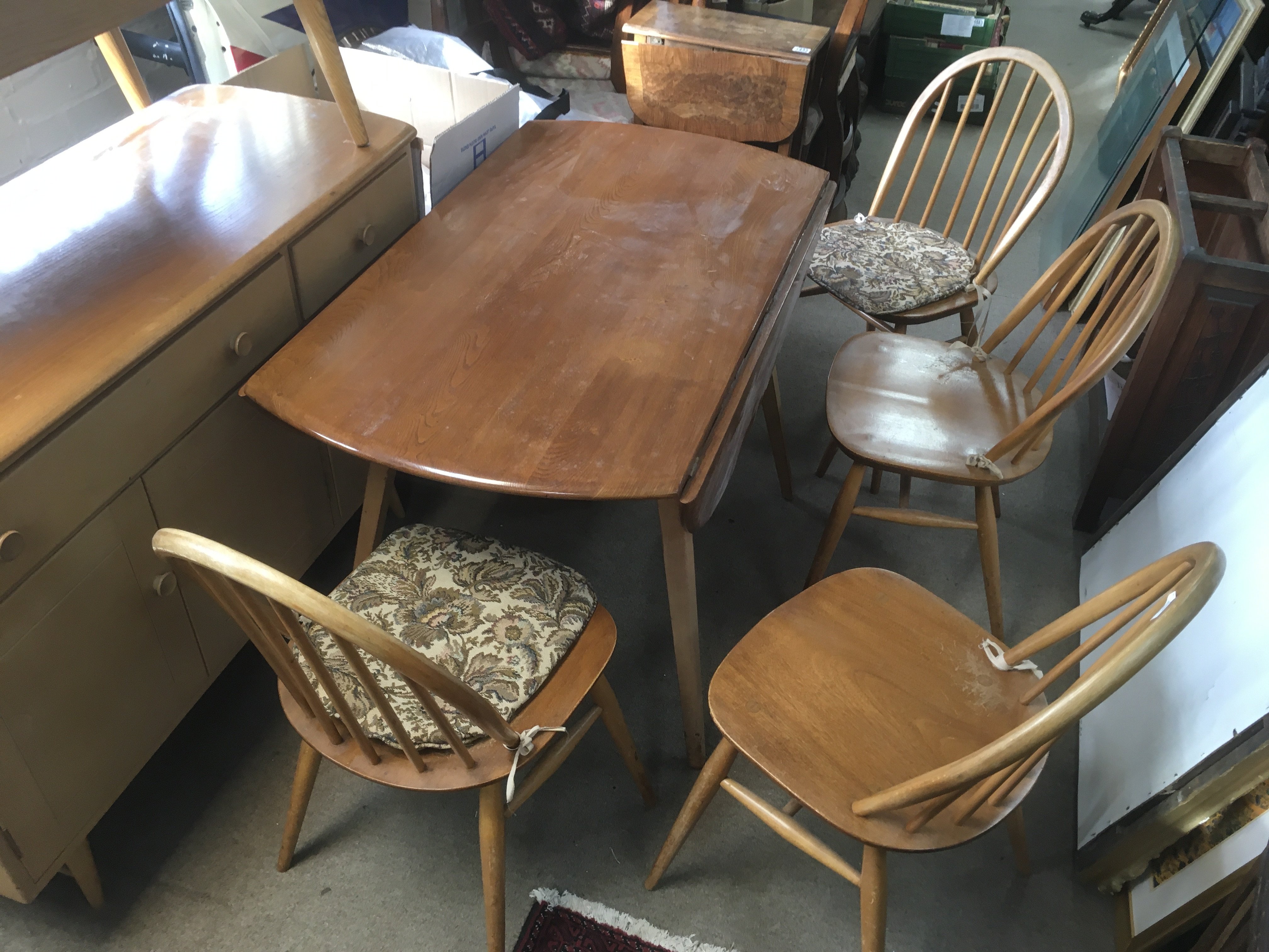 An Ercol dining table and four chairs 82cm tall 62cm wide 69cm tall