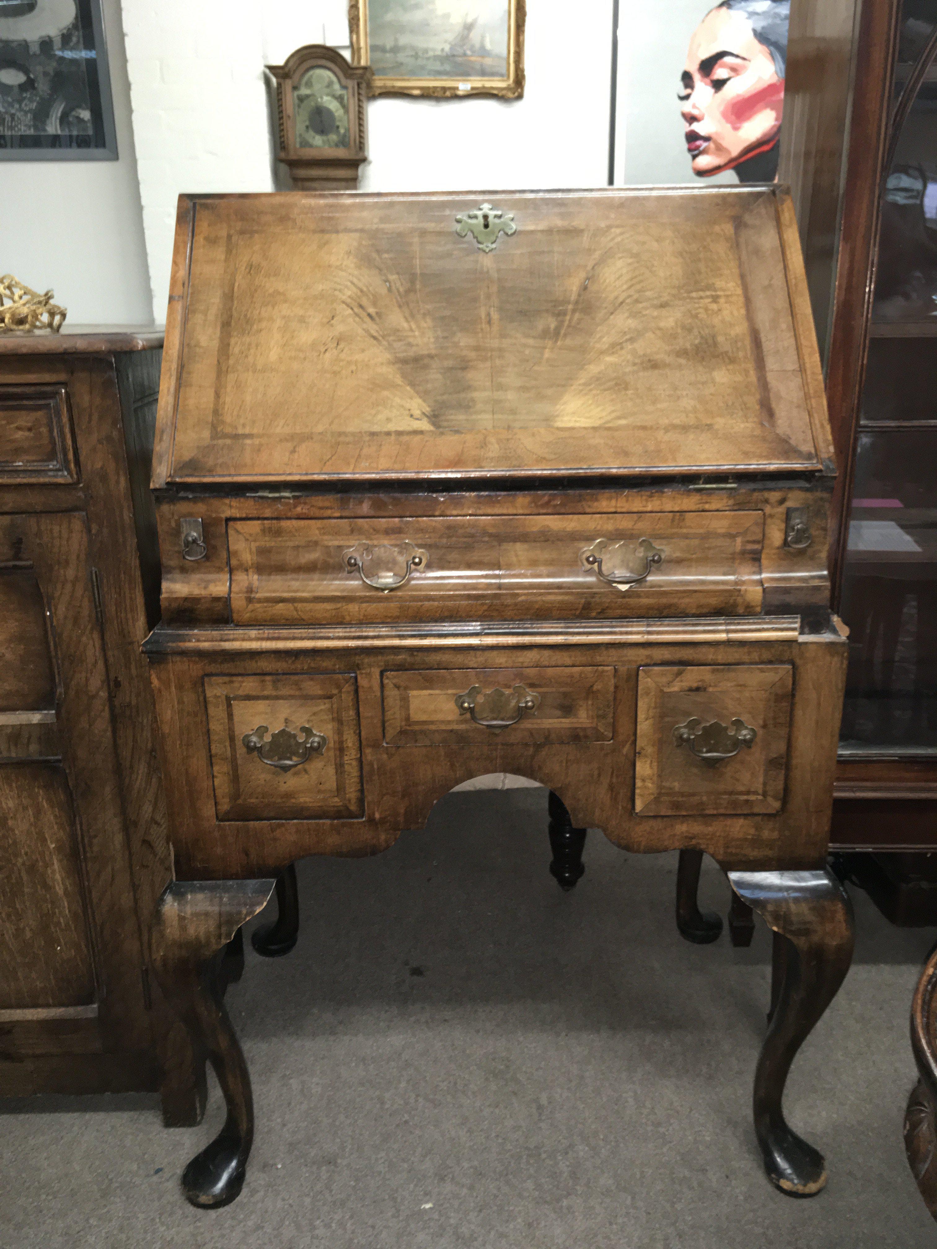 A walnut bureau , dimensions 60cm wide 100cm tall 45cm deep