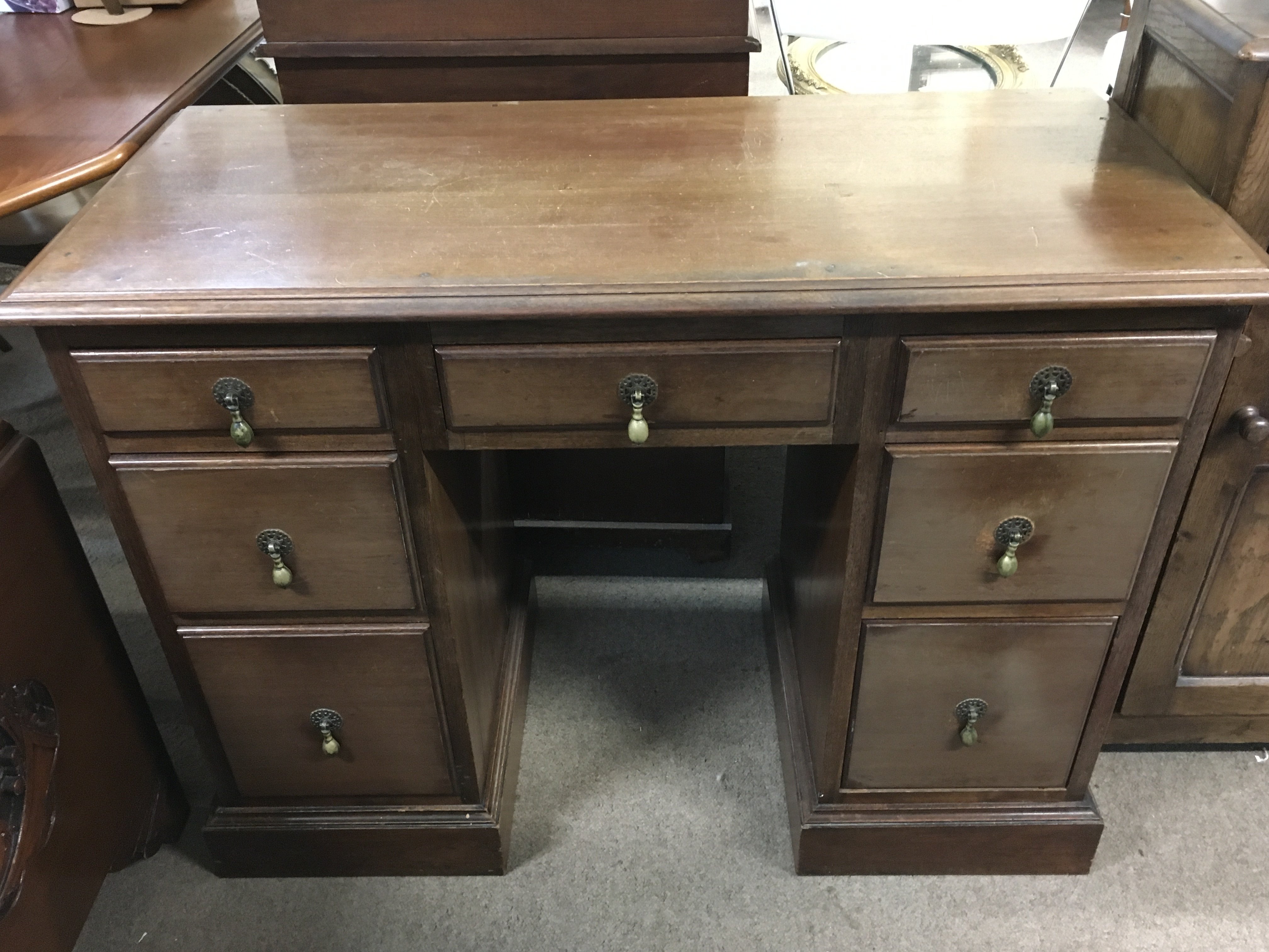 A mahogany pedestal desk, dimensions 99cm wide 75cm tall
