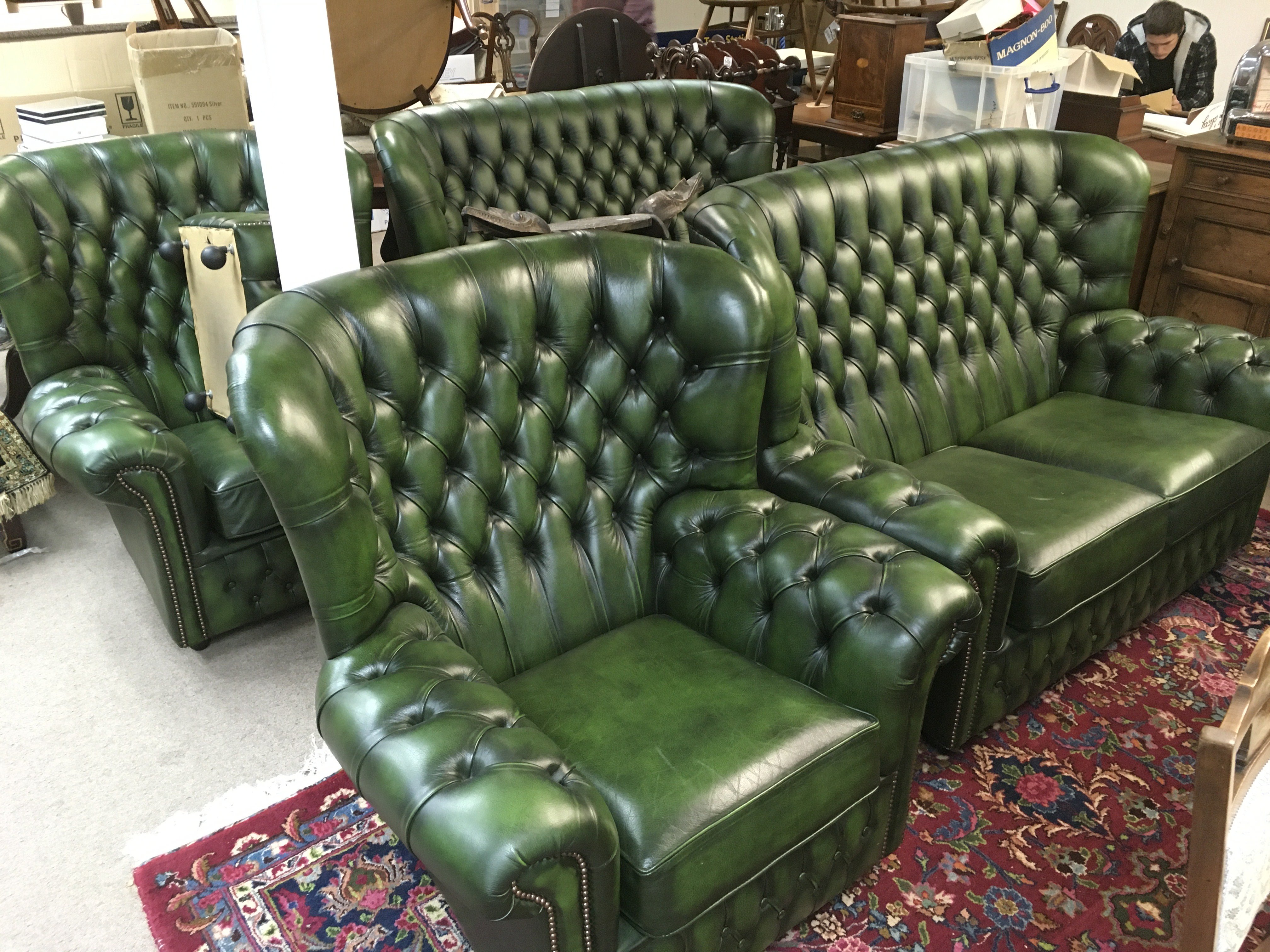 A five piece green button back Chesterfield suite. Shipping category D.