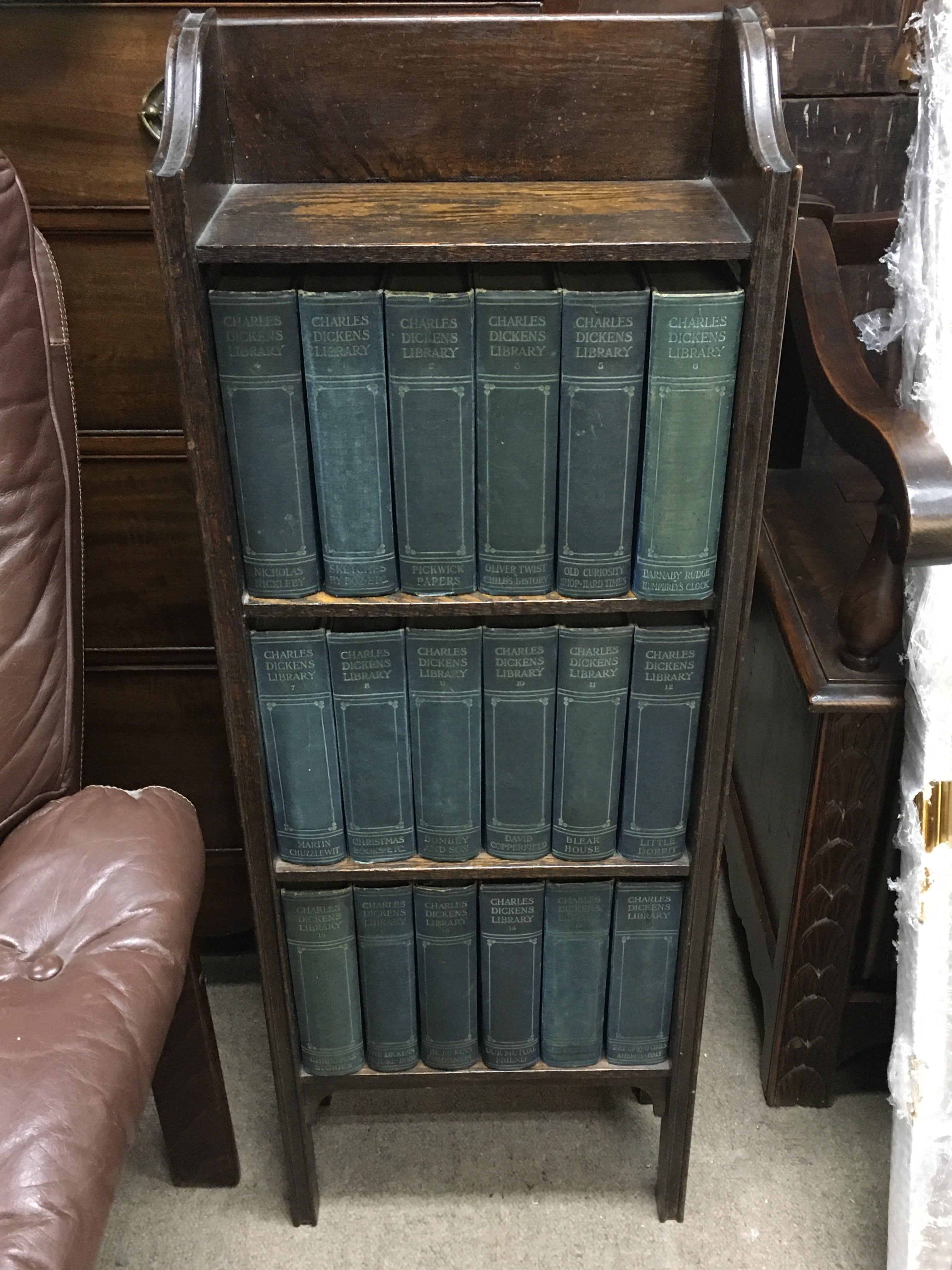 Later edition dickens books in a bookcase 94cm tall.