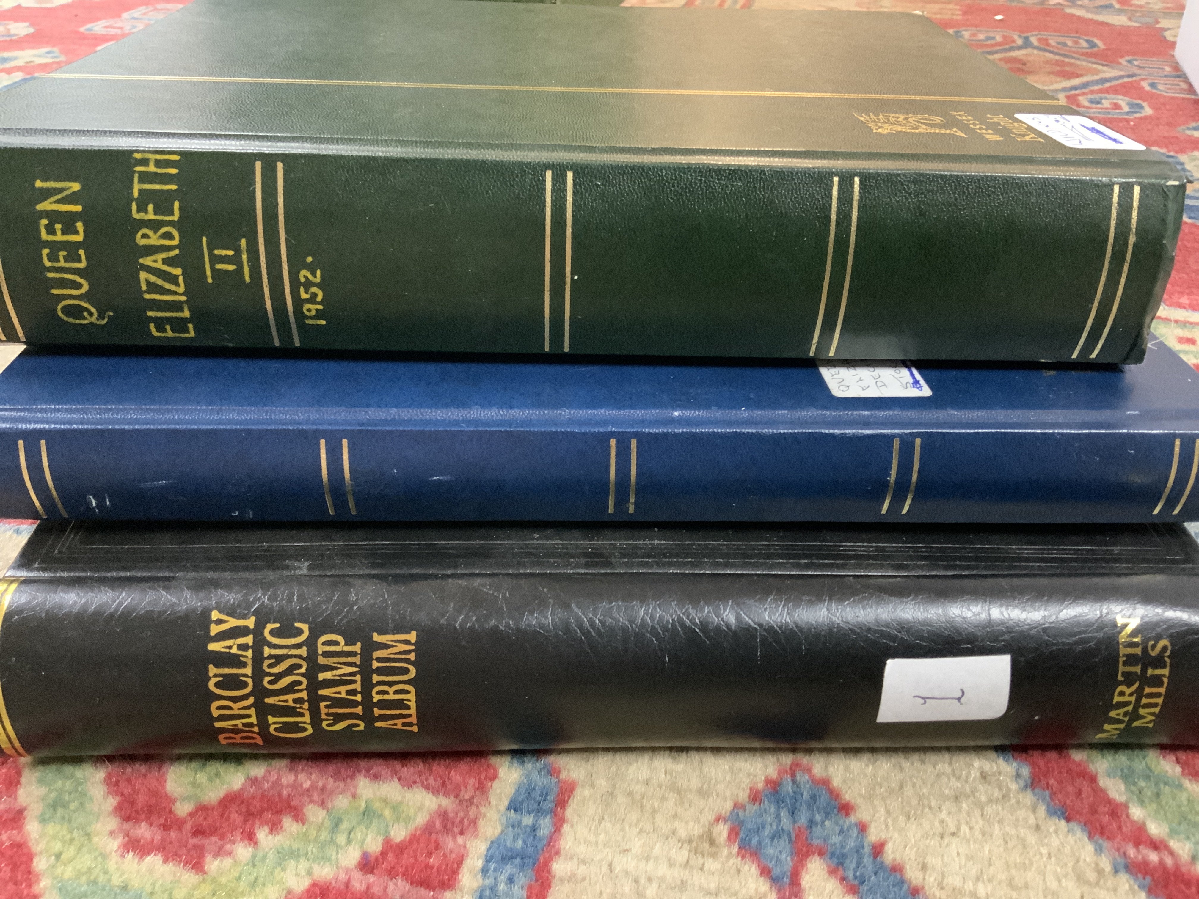 A Queen Elizabeth II 1952 album of Wildings together with 2 additional albums of British stamps.