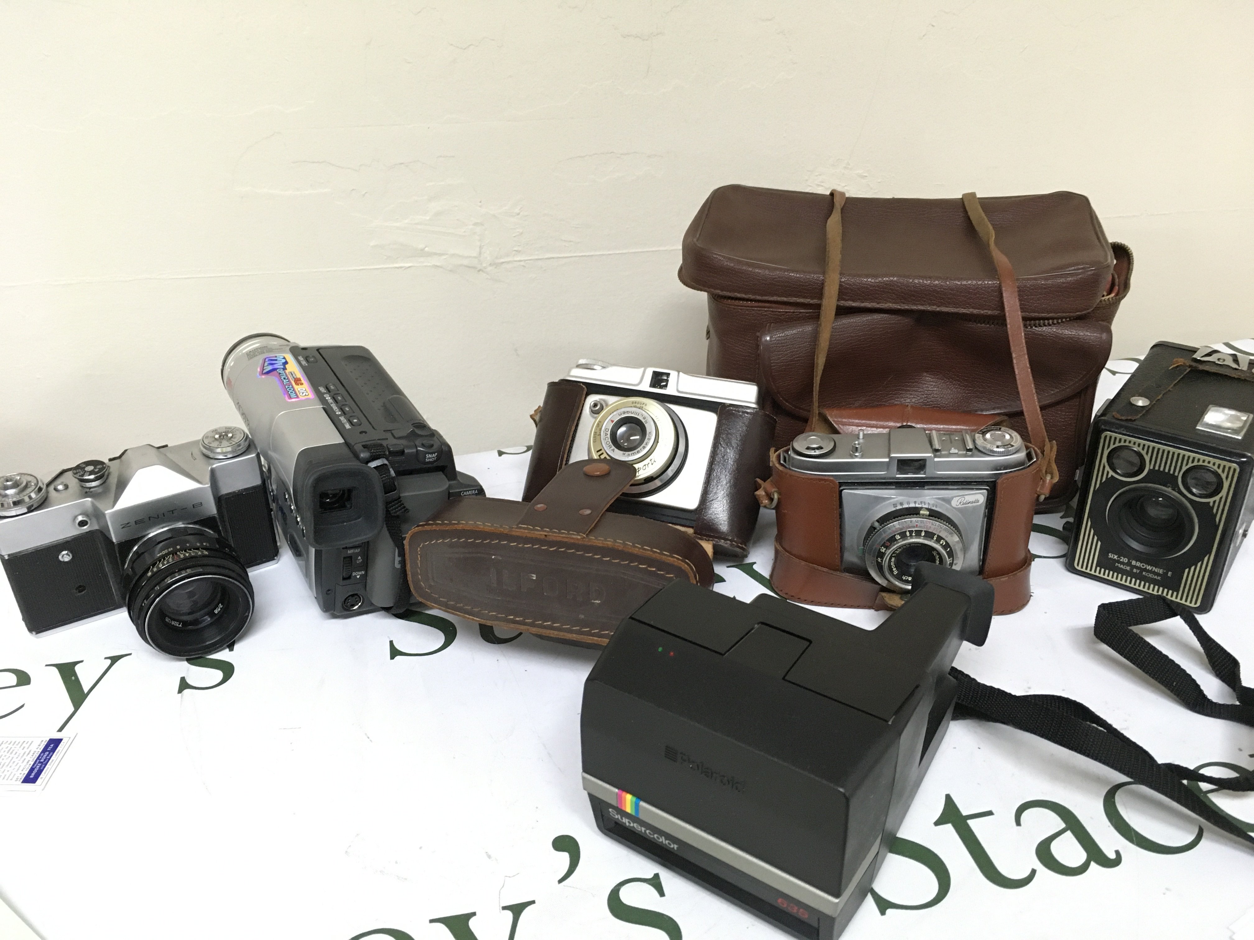 A box of vintage cameras including a Zenit-B, Ilford Sporti, Retinette, SIX-20 Brownie E etc. this lot cannot be posted. NO RESERVE