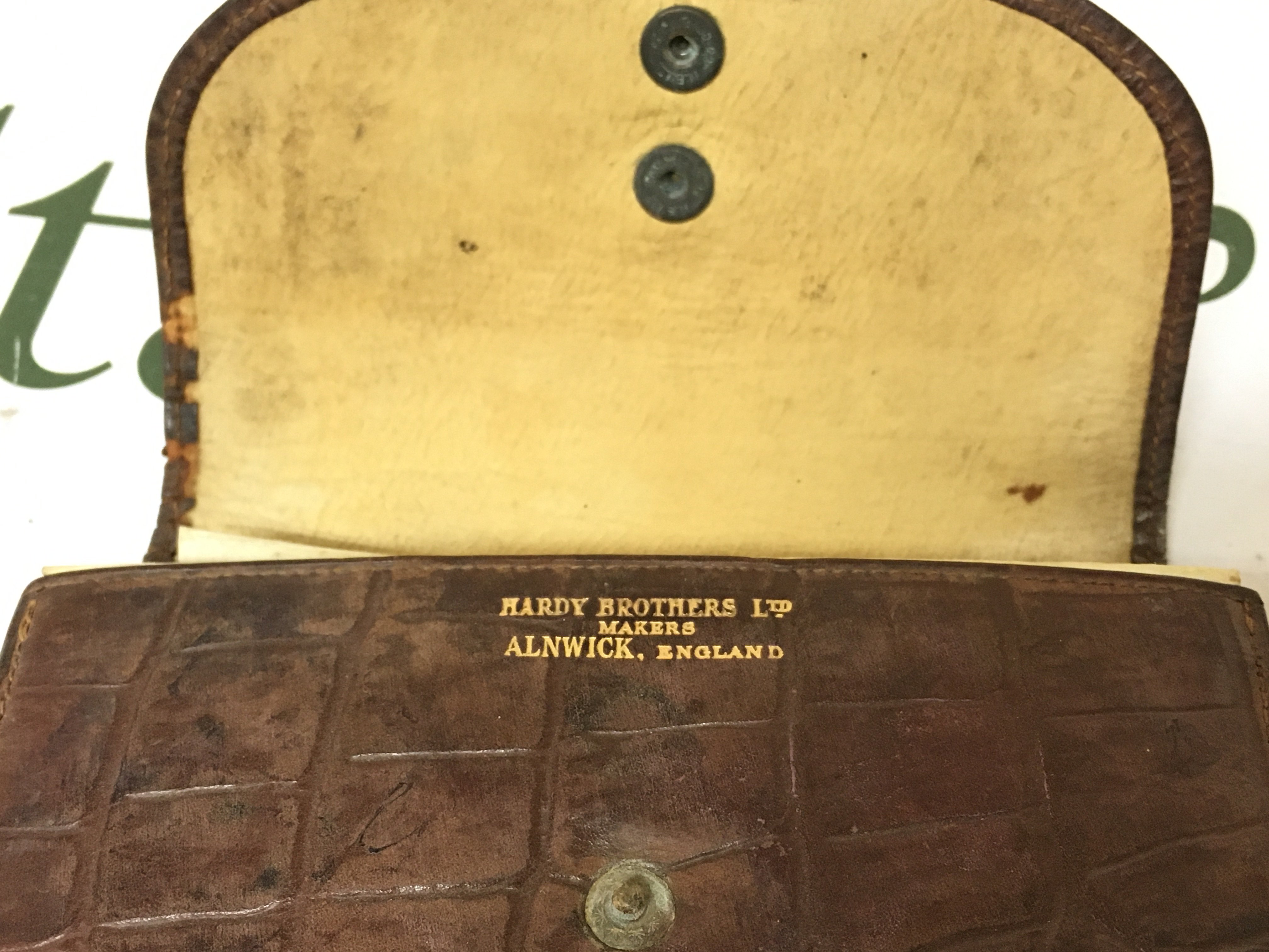 A leather Hardy Fly cast wallet , and a fish knife (German made blade). Postage category A. NO RESERVE