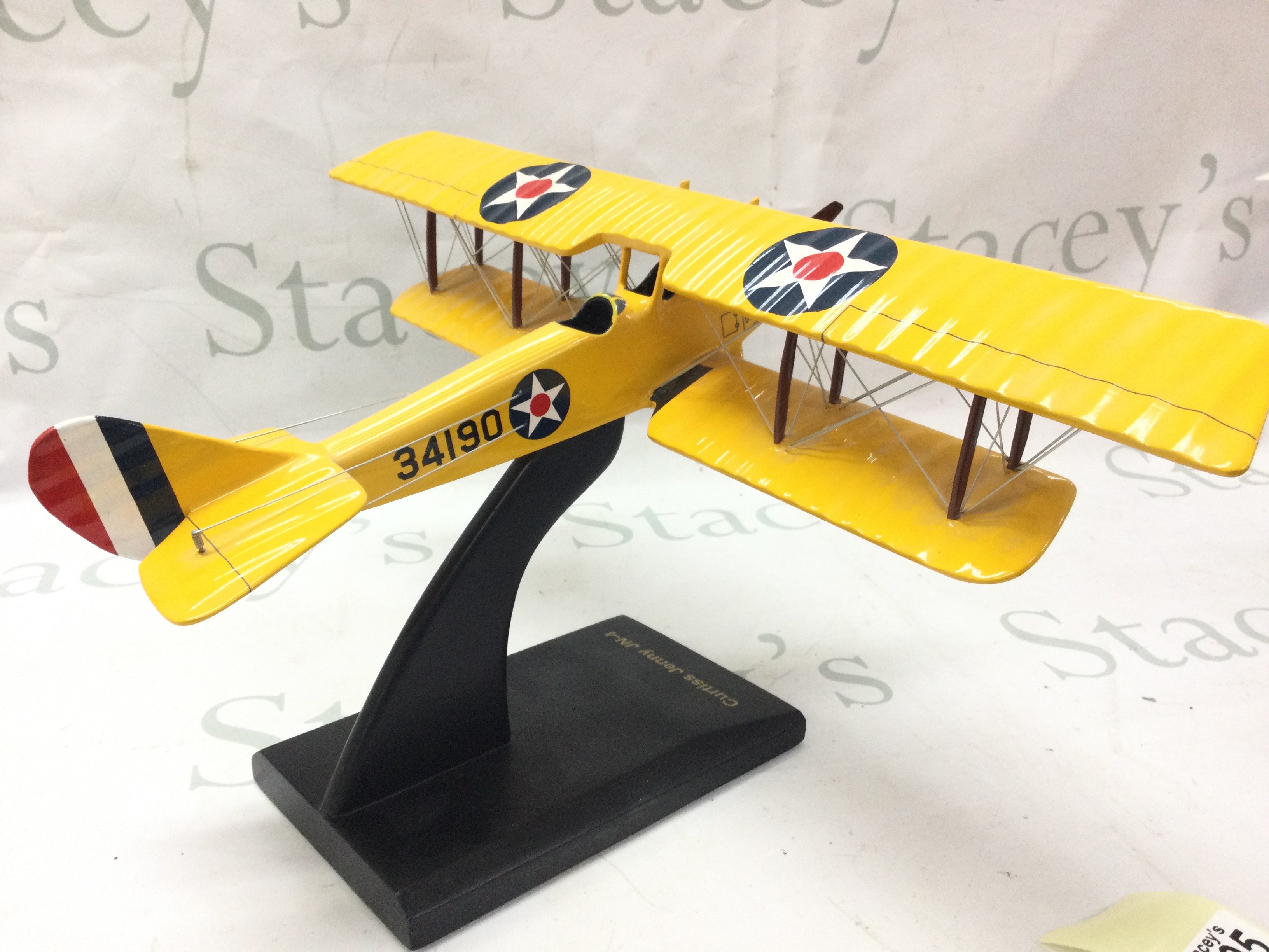 A model aeroplane Curtiss Jenny JN-4 , made in the Philippians. 21cm tall. Postage category C. NO RESERVE