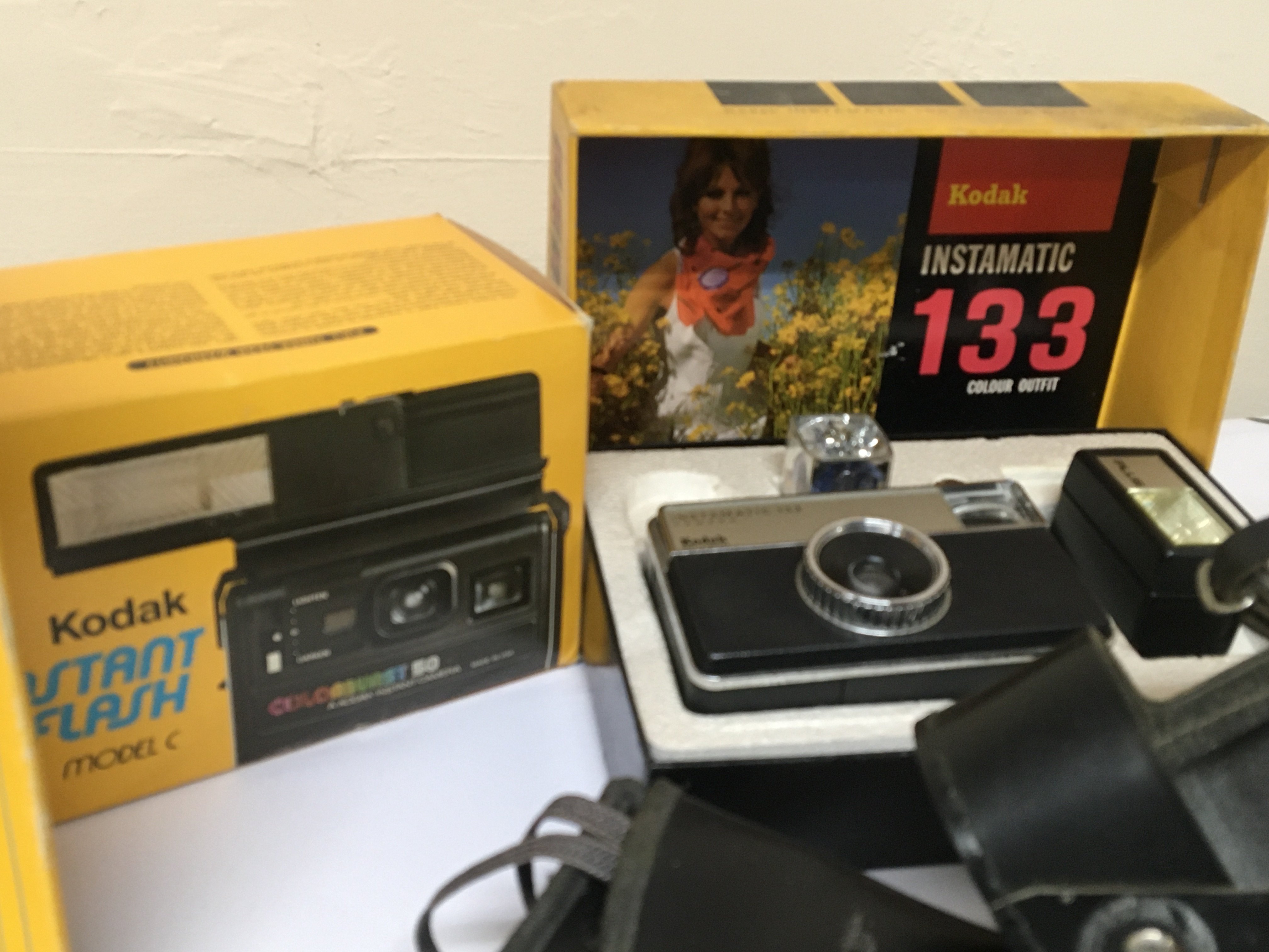 A collection of Vintage cameras boxed and as new Kodak Instamatic 133 Kodak EK160 instant flash Model C a Cosmic 35 with box and other cameras.- NO RESERVE