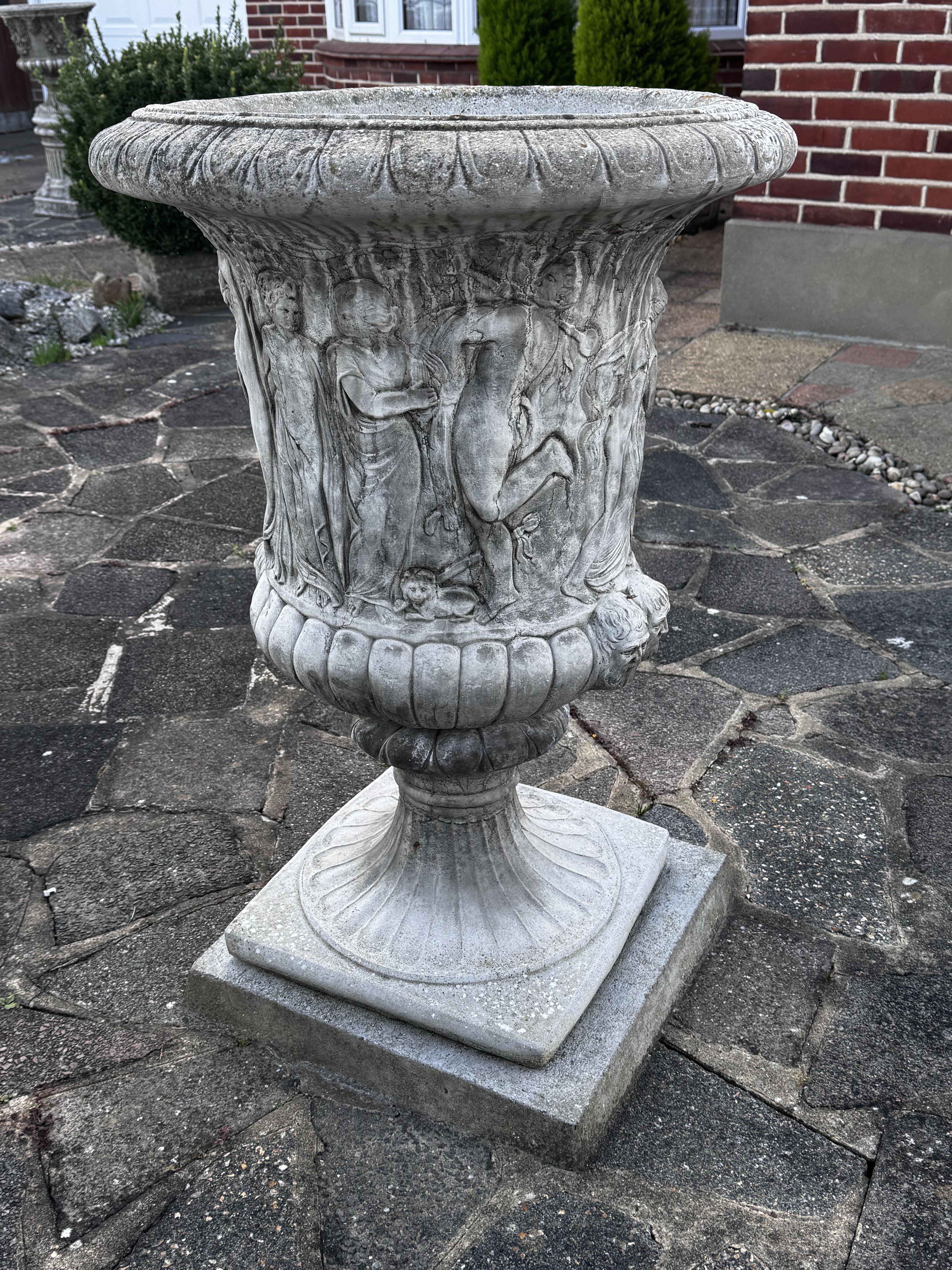 A large cast concrete planter of classical design (Sold in situ).- NO RESERVE