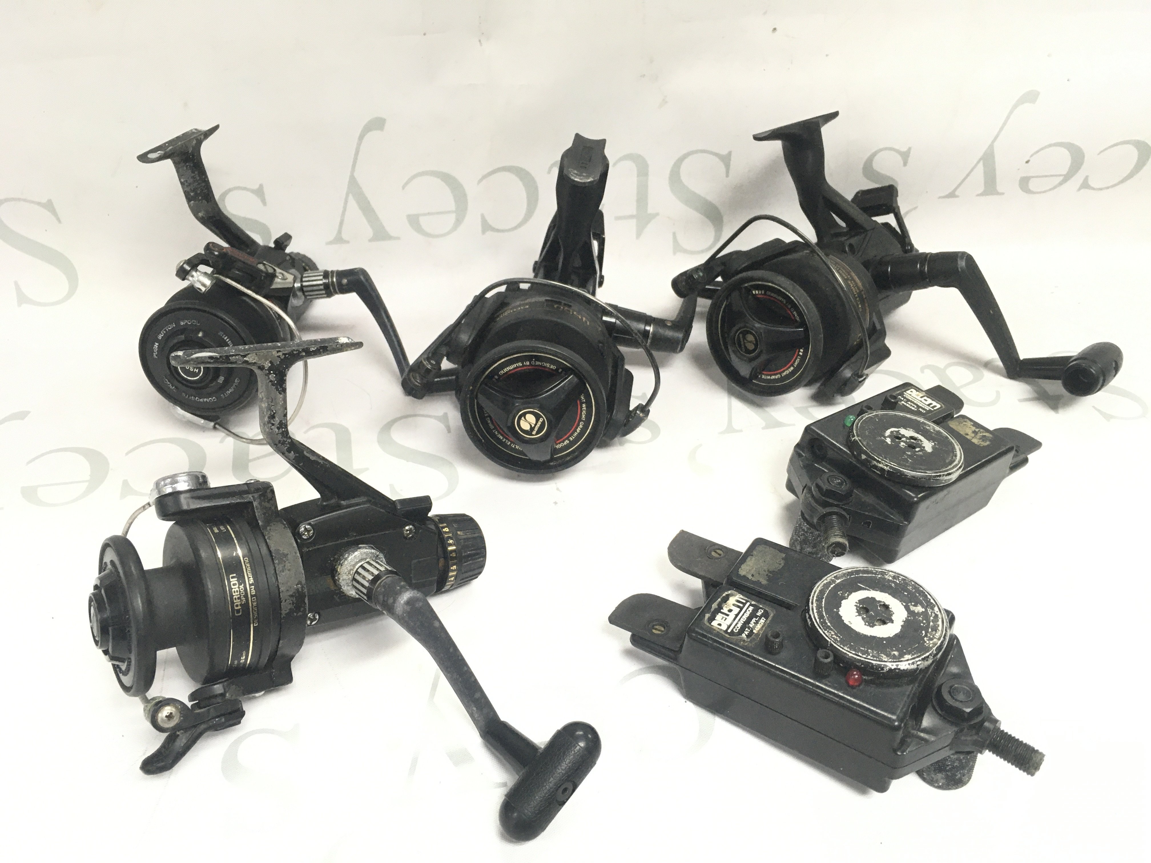 Fishing spinning reels including a Shimano x3000, 4500, etc . Postage category B