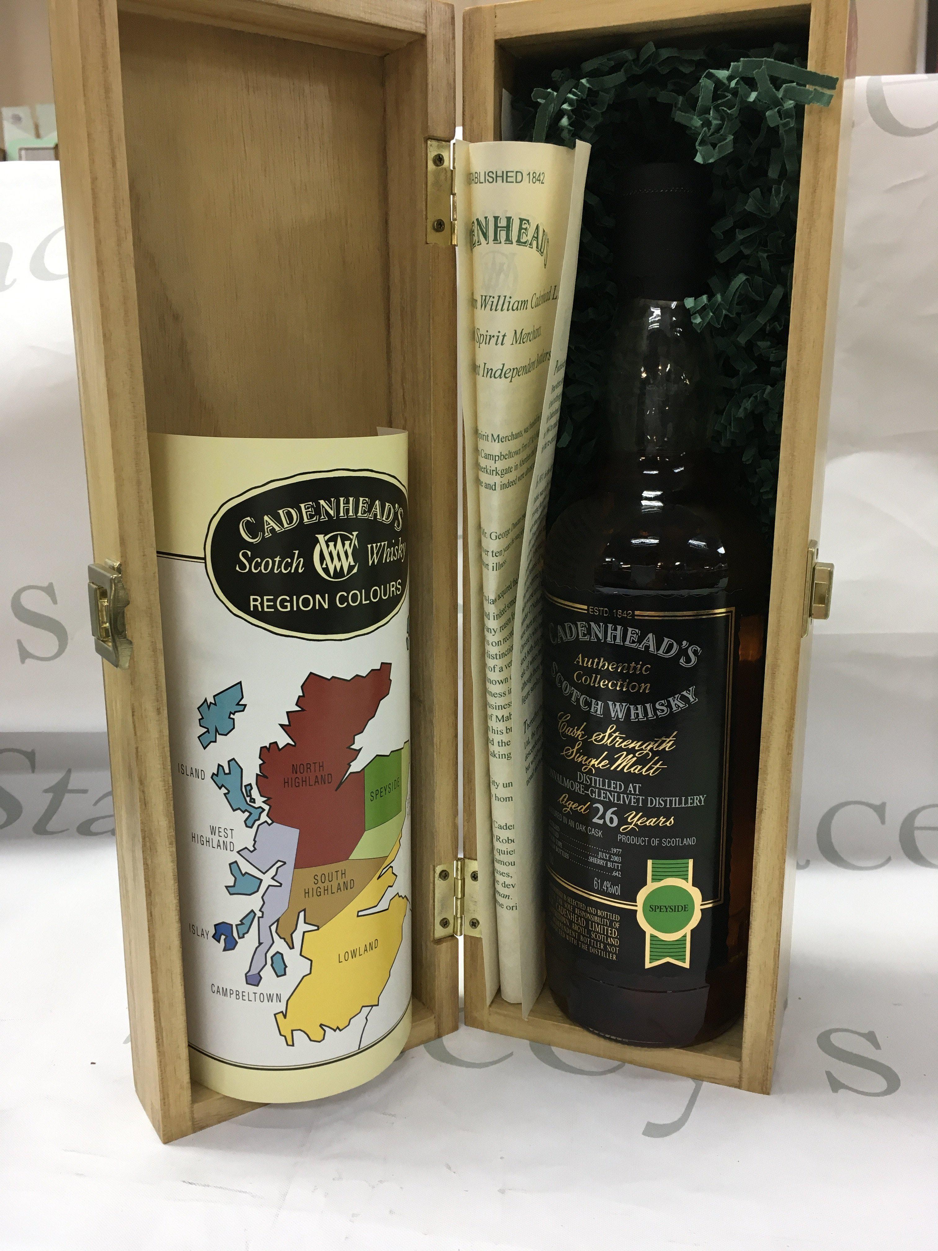 A bottle of 26 year old single malt cadenheads scotch whiskey with with paper work in a wooden presentation box. Very good condition and level.