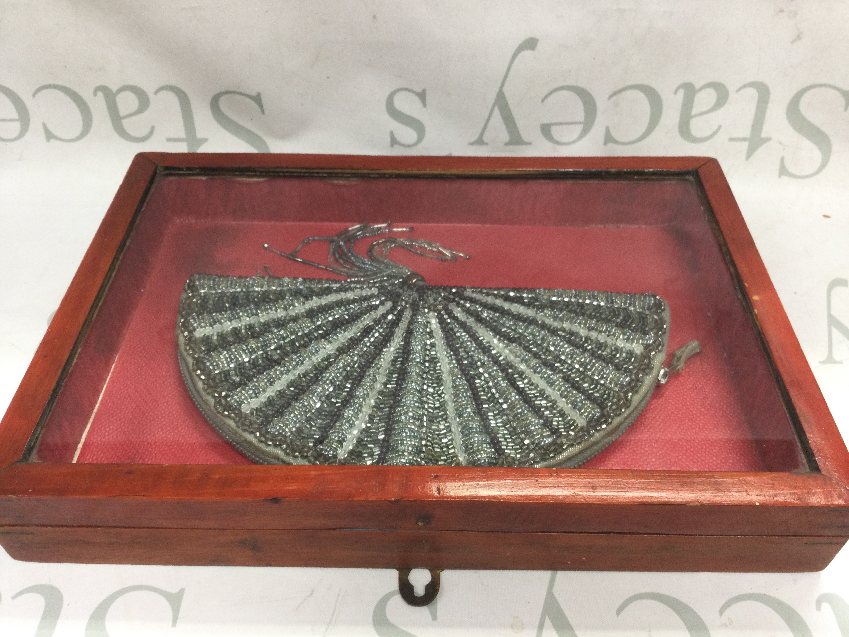 An unusual small handbag in a display case . 33cm long This lot cannot be posted