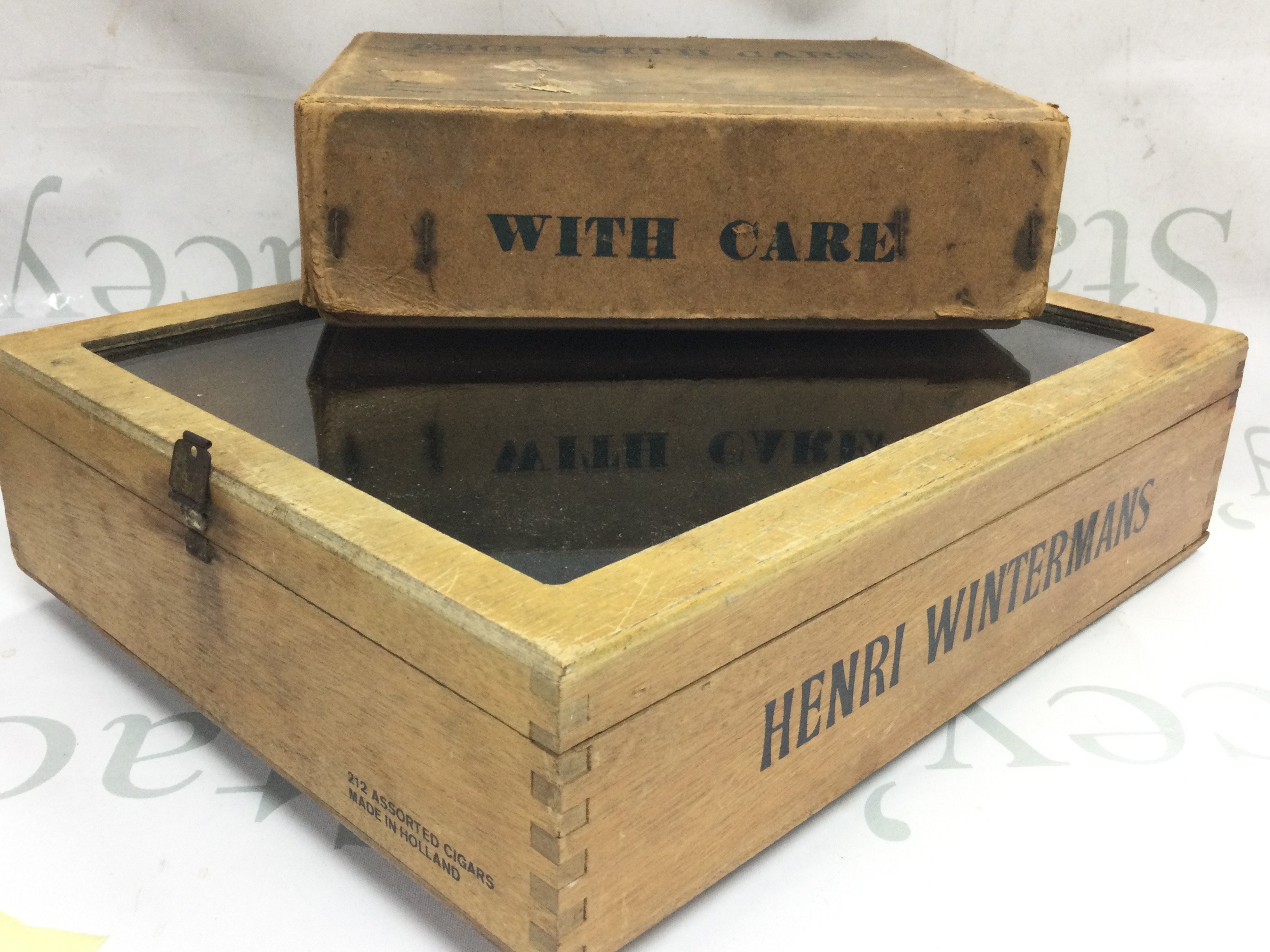 A small Henri Wintermans cigar display shop case and vintage cardboard fitted egg box