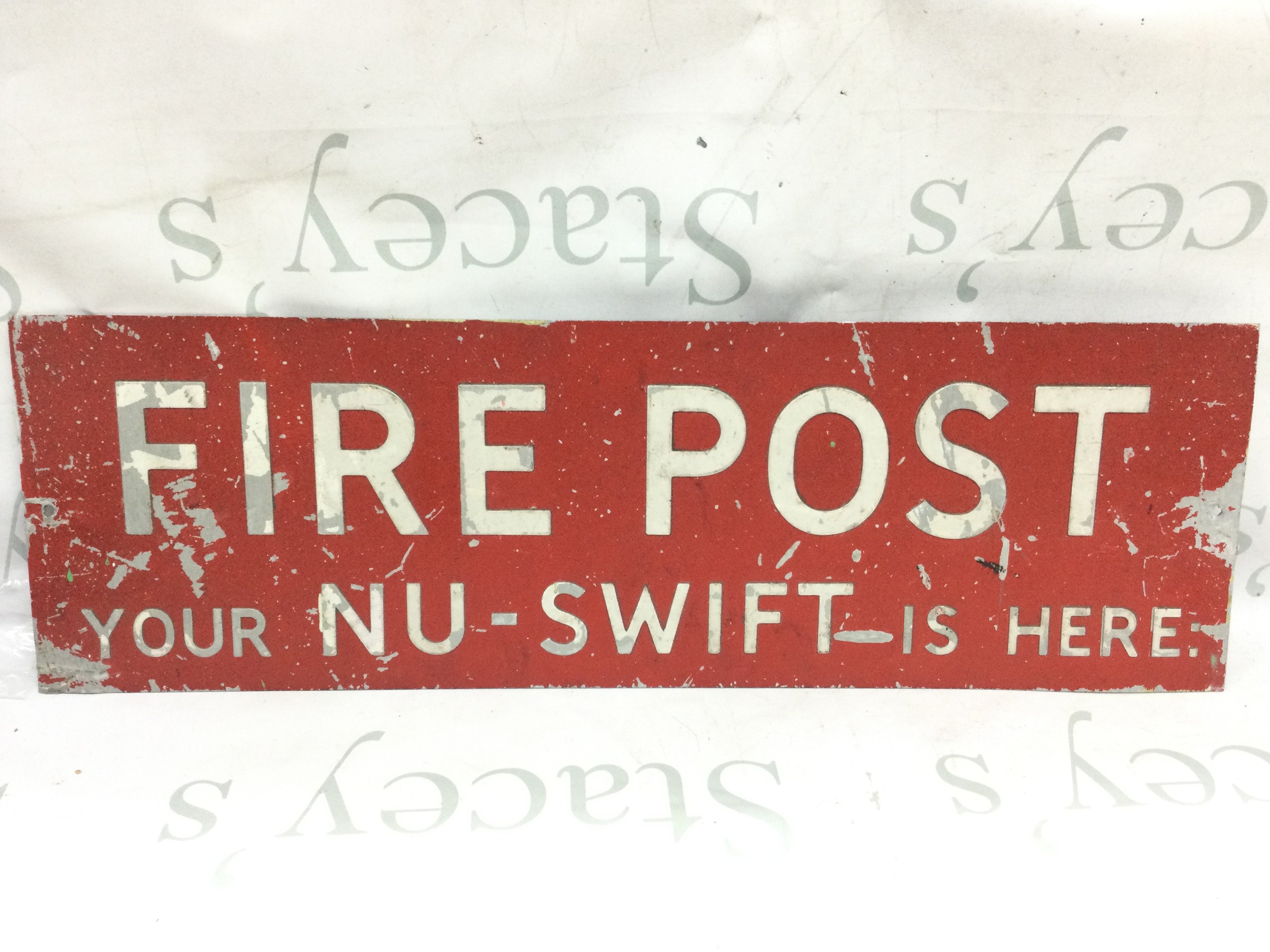 A vintage metal advertising sign for fire post 61cm tall 19cm tall