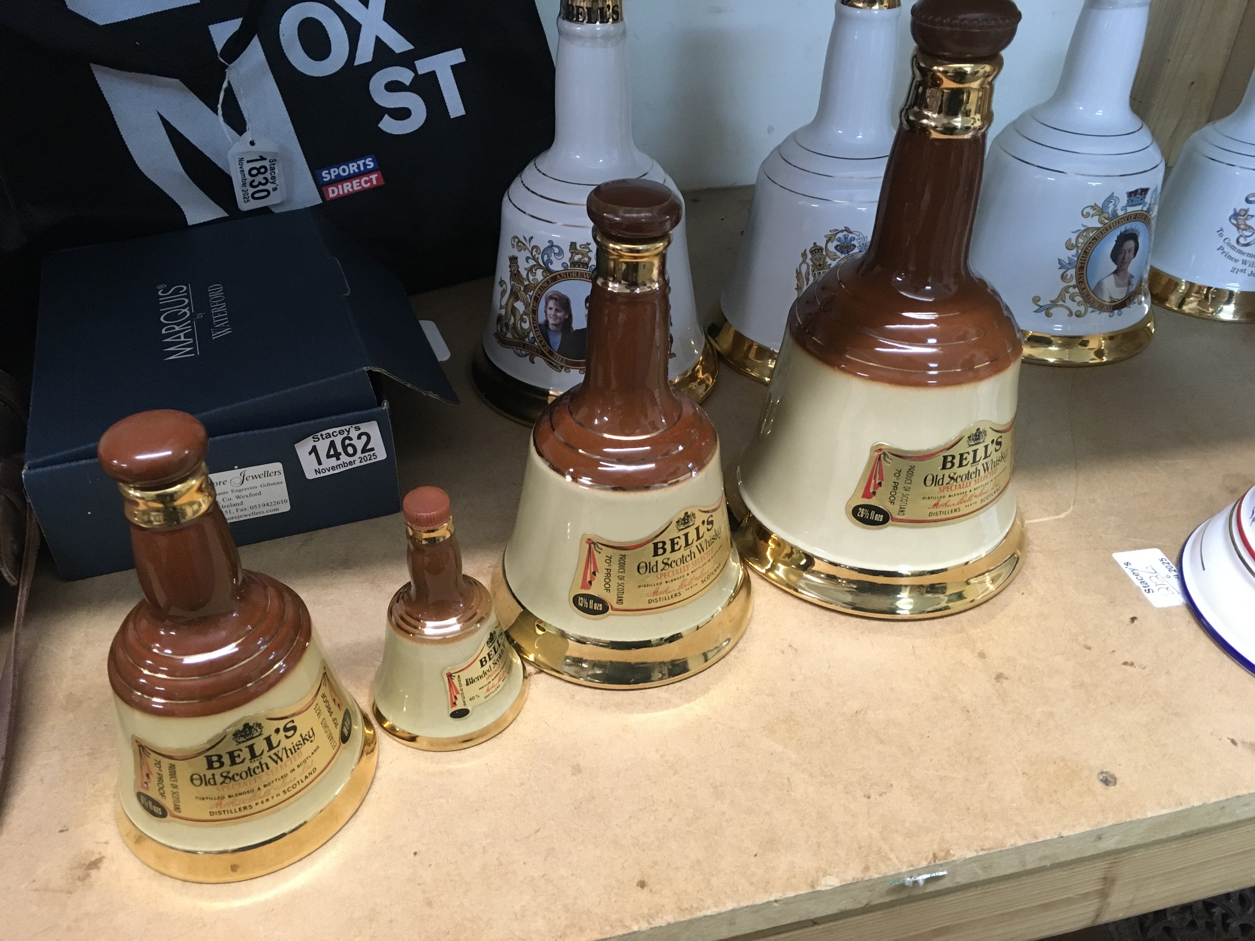 A Collection of 10 bells scotch whisky decanters various commemorative.