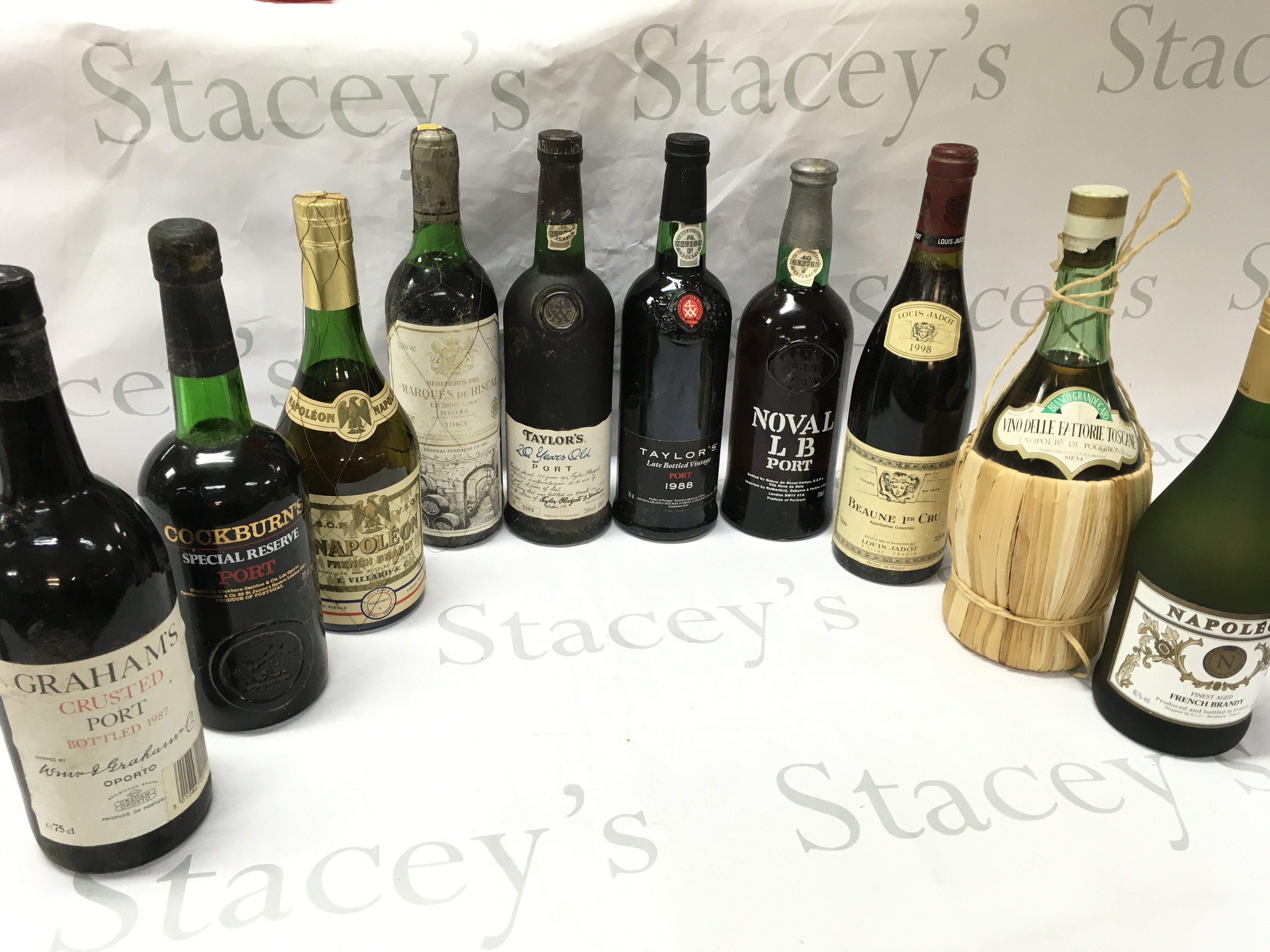 A Collection of spirits including Graham Crusted port bottled 1987, Cockburns Special reserve port, Napoleon french brandy, Marques de Riscal 1983 , Taylors 1988, Noval LB Port, Louis judot 1998 Beaune 1er cru , Vino Delle Fattorie Toscane enopolio di poggibonsi. This lot cannot be posted