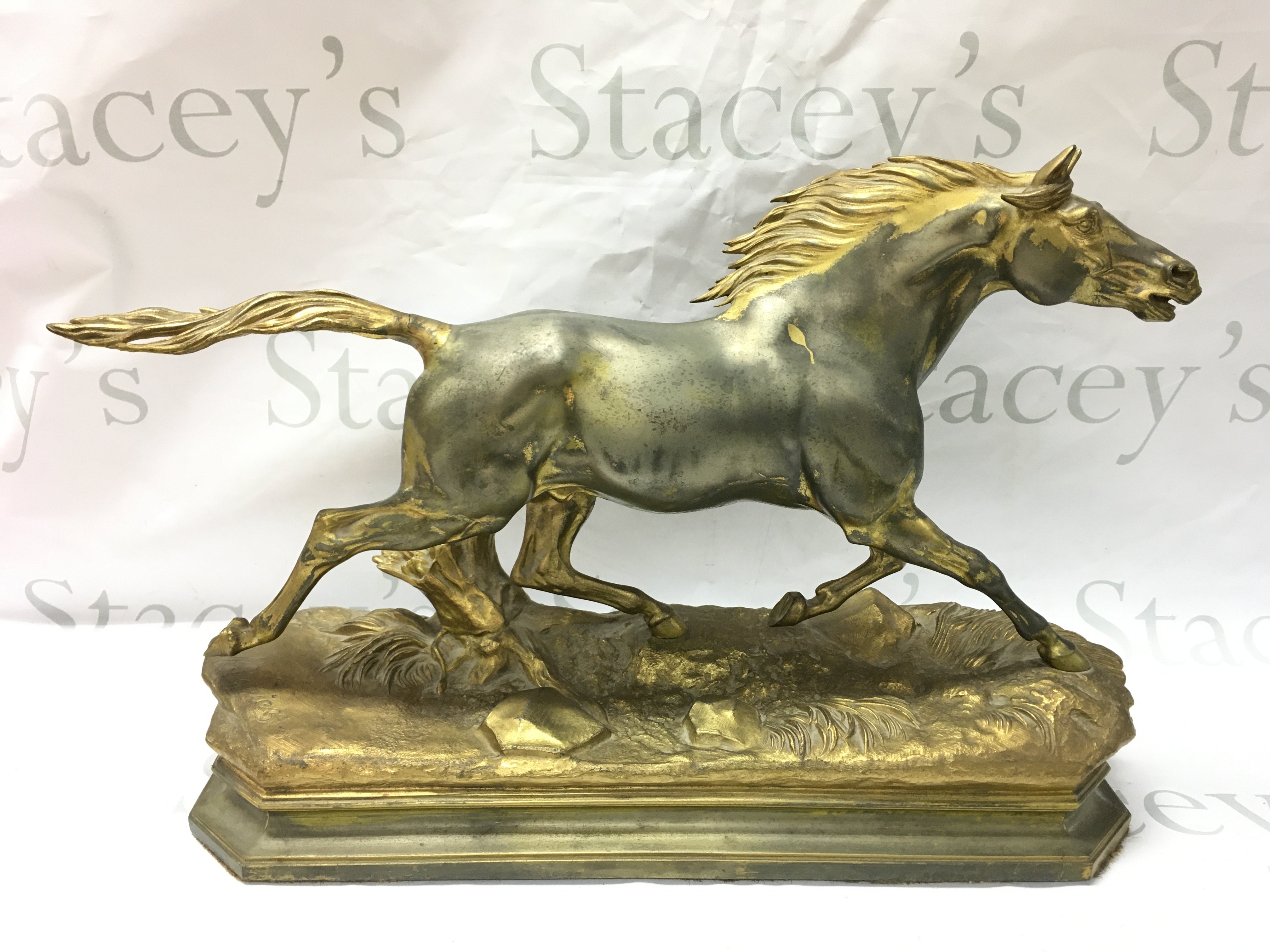 A Jules Moigniez spelter gilted horse, 48cm wide . This lot cannot be posted