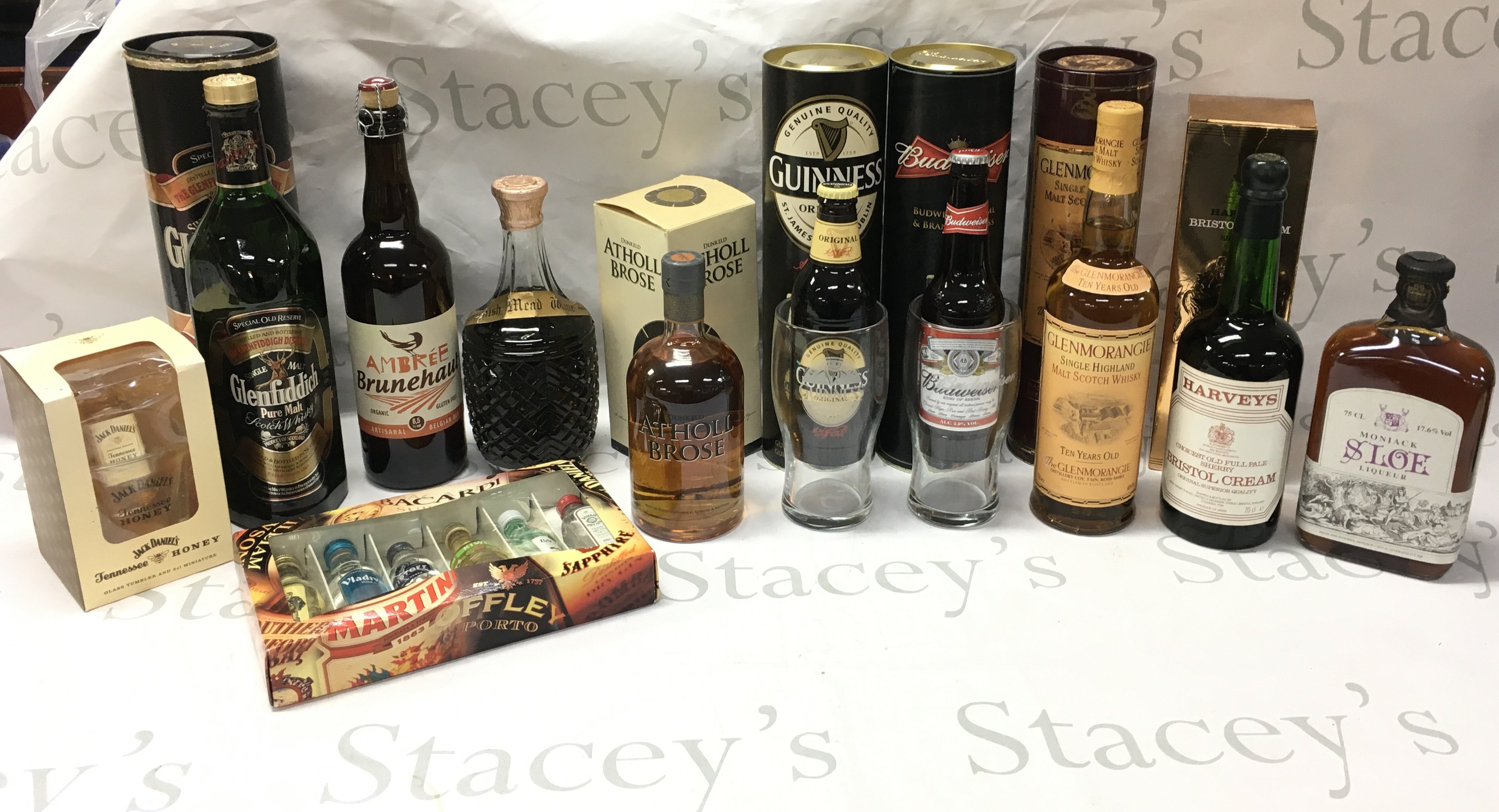 A Collection of alcohol including Glenfiddich pure malt scotch whiskey, Belgian Ale, Cornish mead wine, Dunkeld Antholl Brose Scotch whiskey, Glenmorangie Single highland malt scotch whiskey, Harveys Bristol Cream, Moniack sloe liqueur etc . This lot cannot be posted