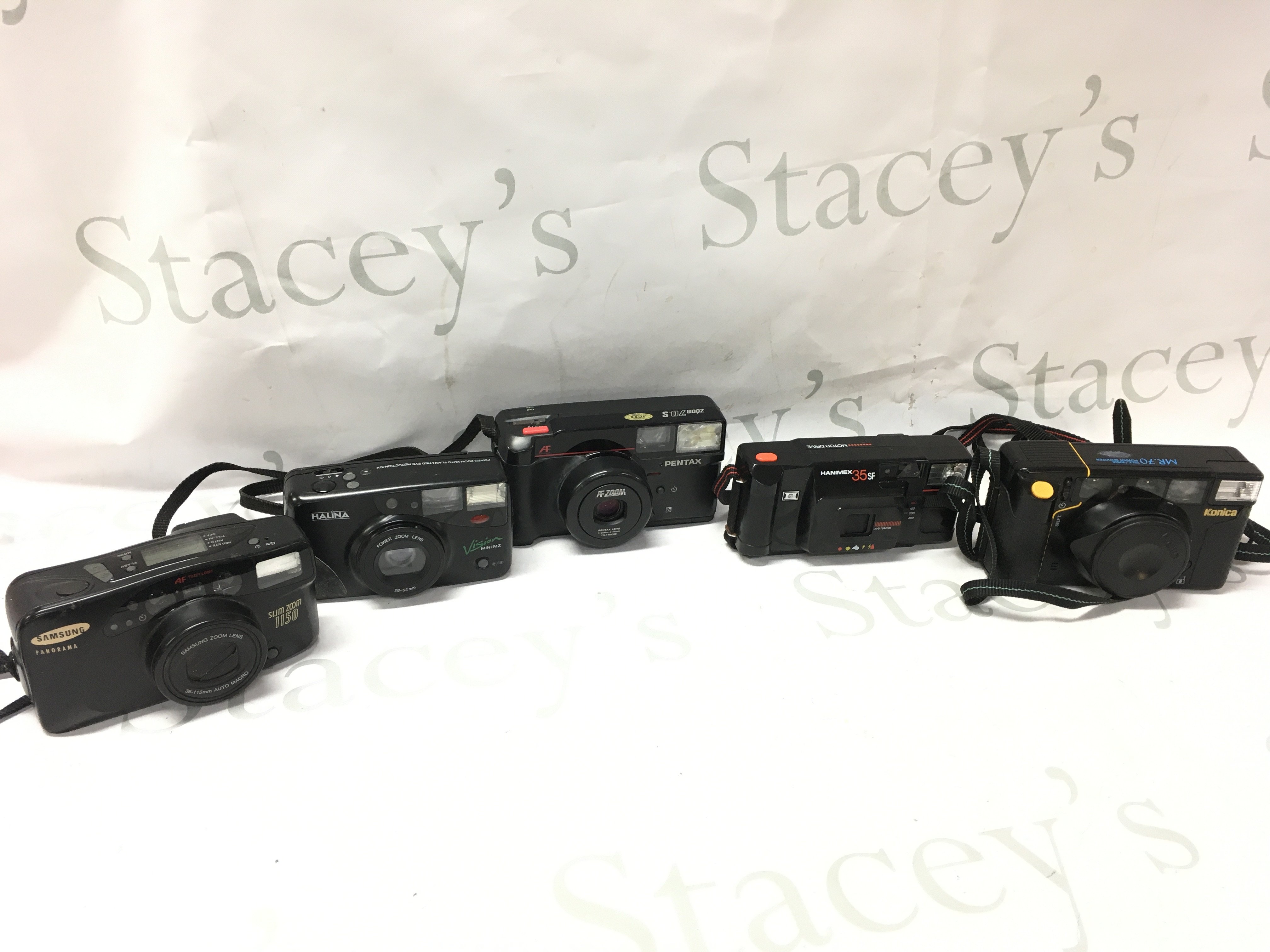 18 point and shoot cameras including Konica, Hanimex 35 SF. Postage category C