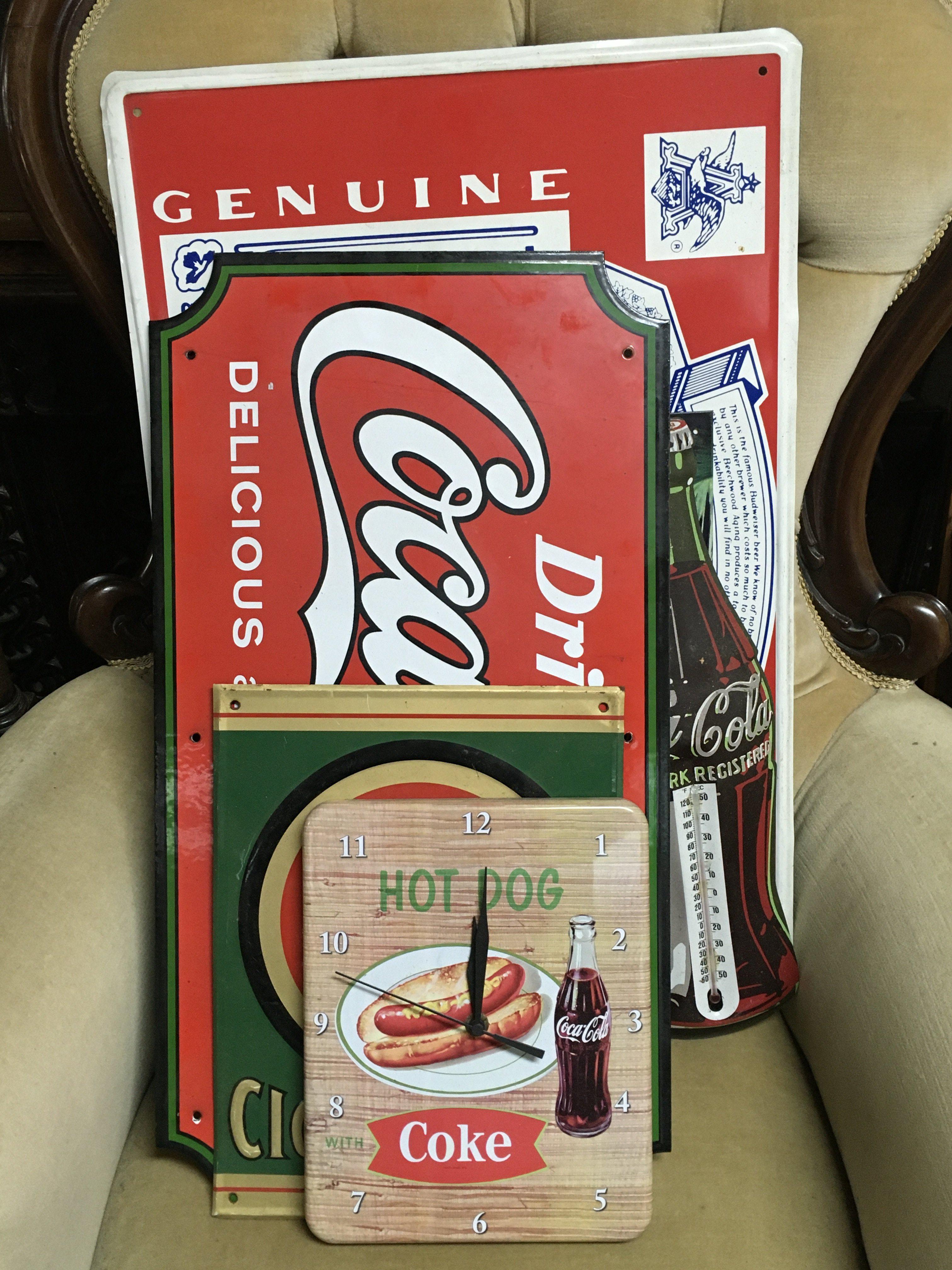 A Collection of vintage metal advertising signs including Coca Cola, Budweiser etc