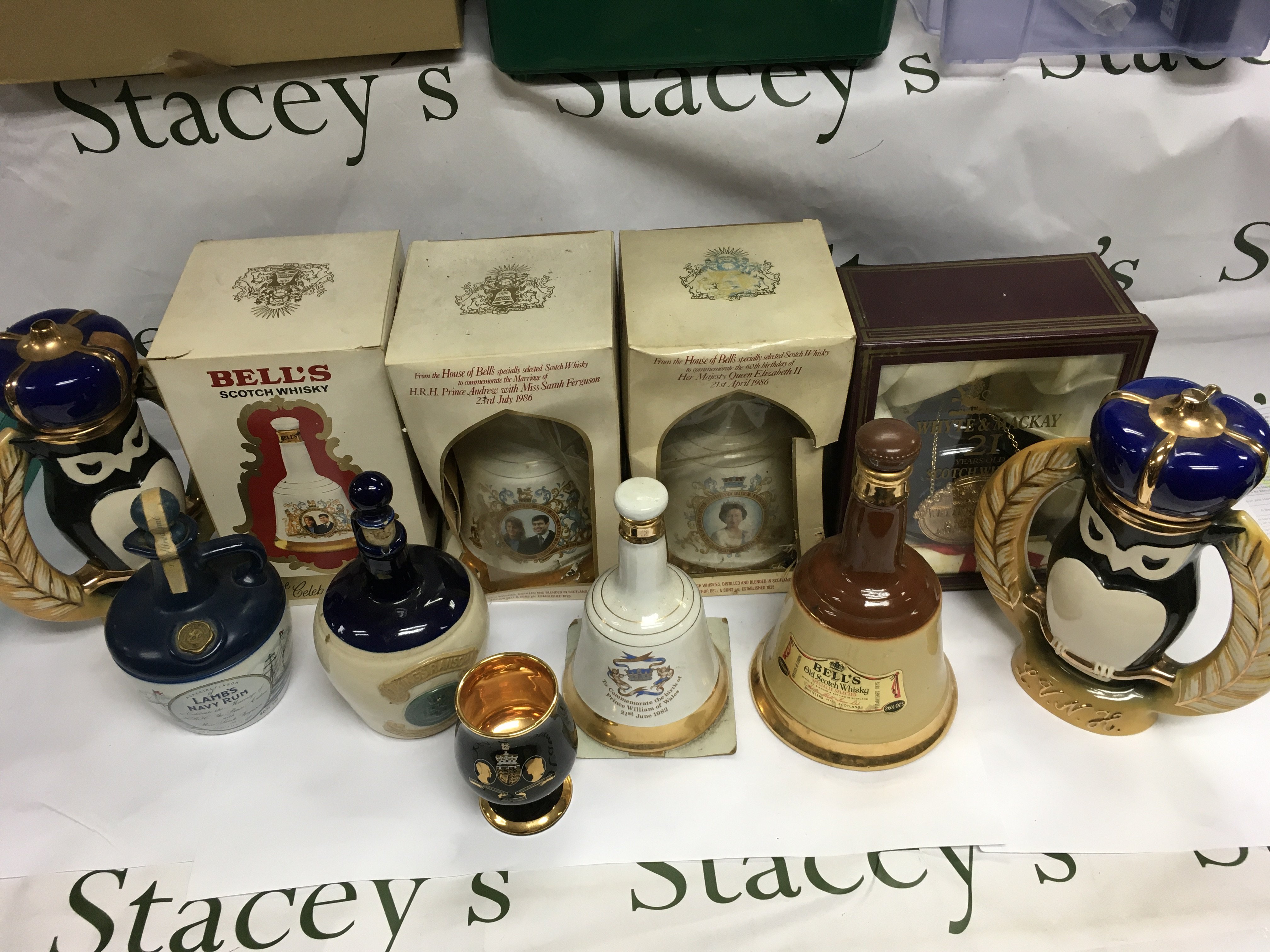 A box of Whiskey and rum decanters.