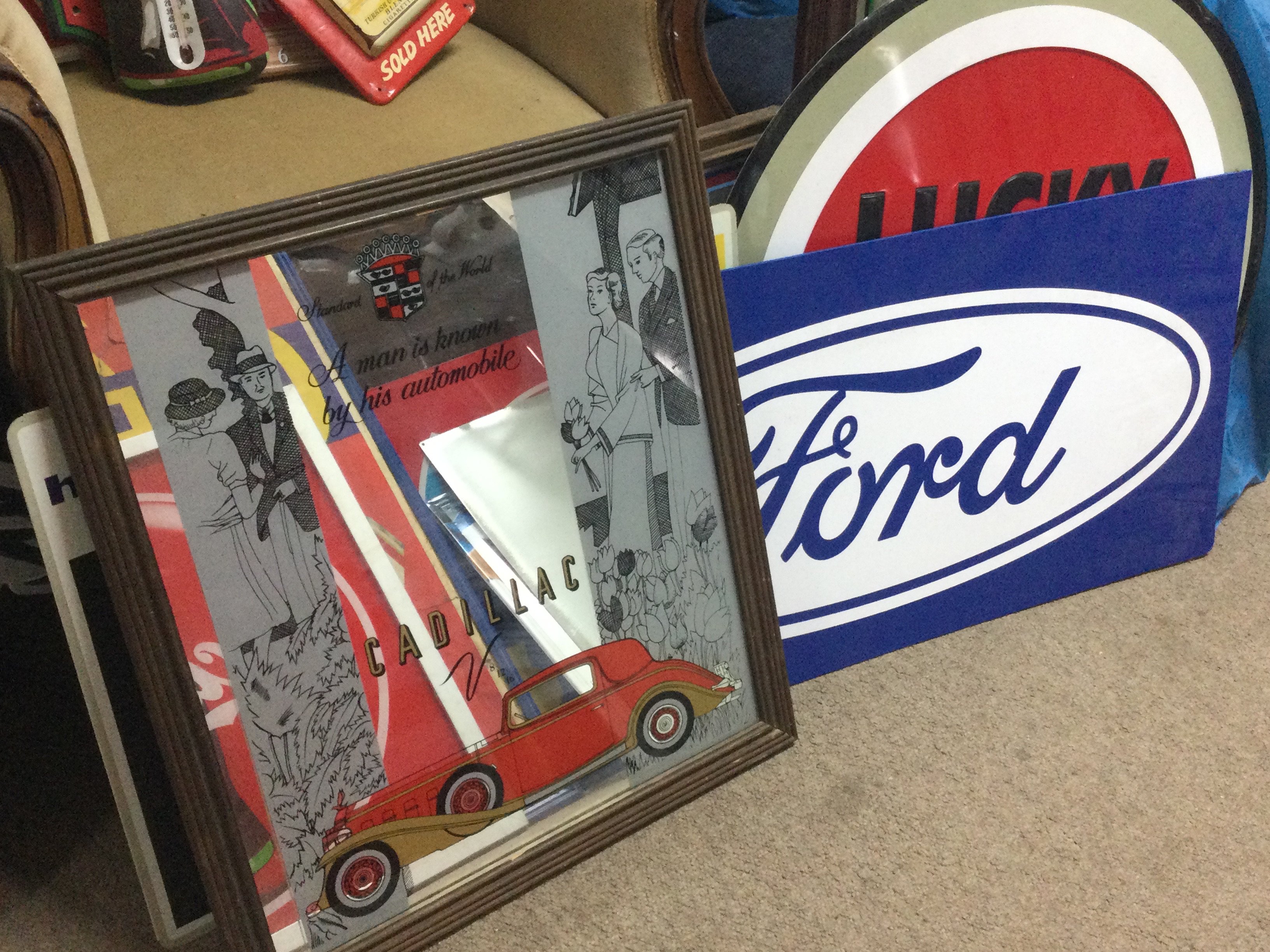 A collection of vintage advertising signs including advertising mirrors Cadillac , Pepsi cola Starsky and hutch , Chesterfield cigarettes, Cola Cola, Lucky Strike metal sign etc. this lot cannot be posted