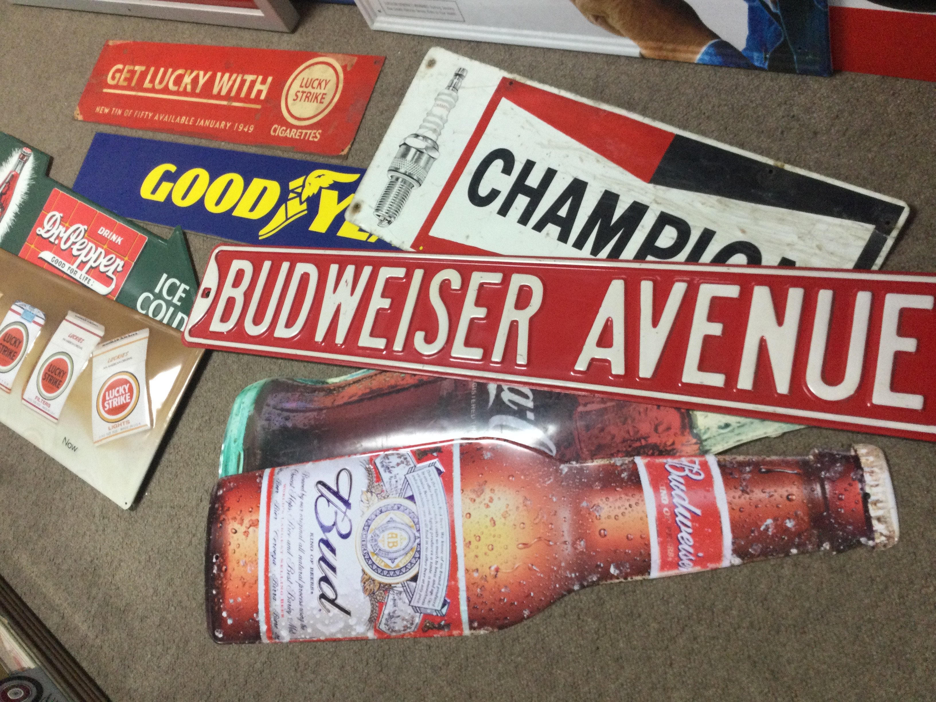 A collection of metal advertising signs including Lucky strike, Budweiser, Dr Pepper, Good year etc this lot cannot be posted