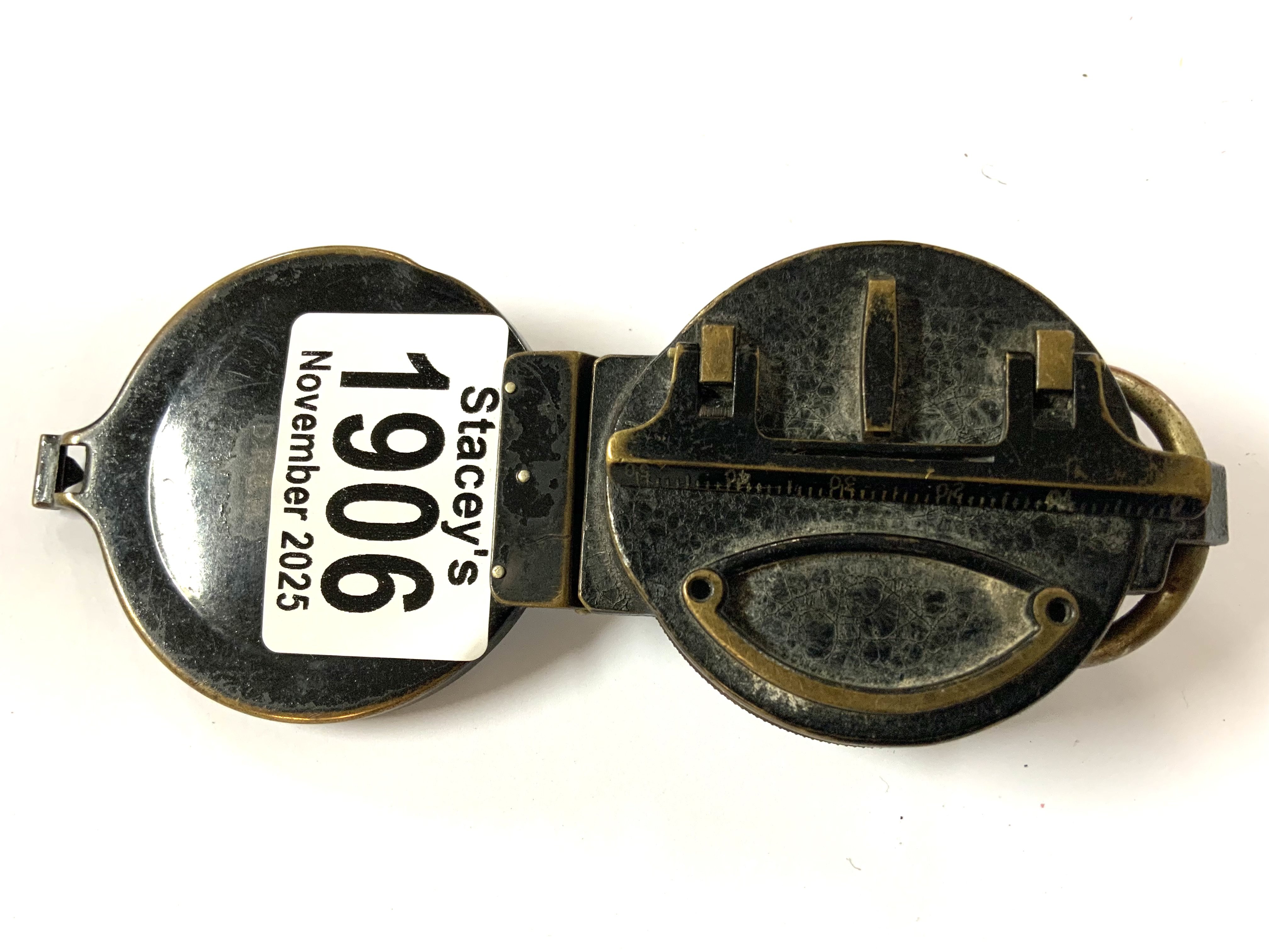 A Vintage Busch DRGM compass and signal mirror.