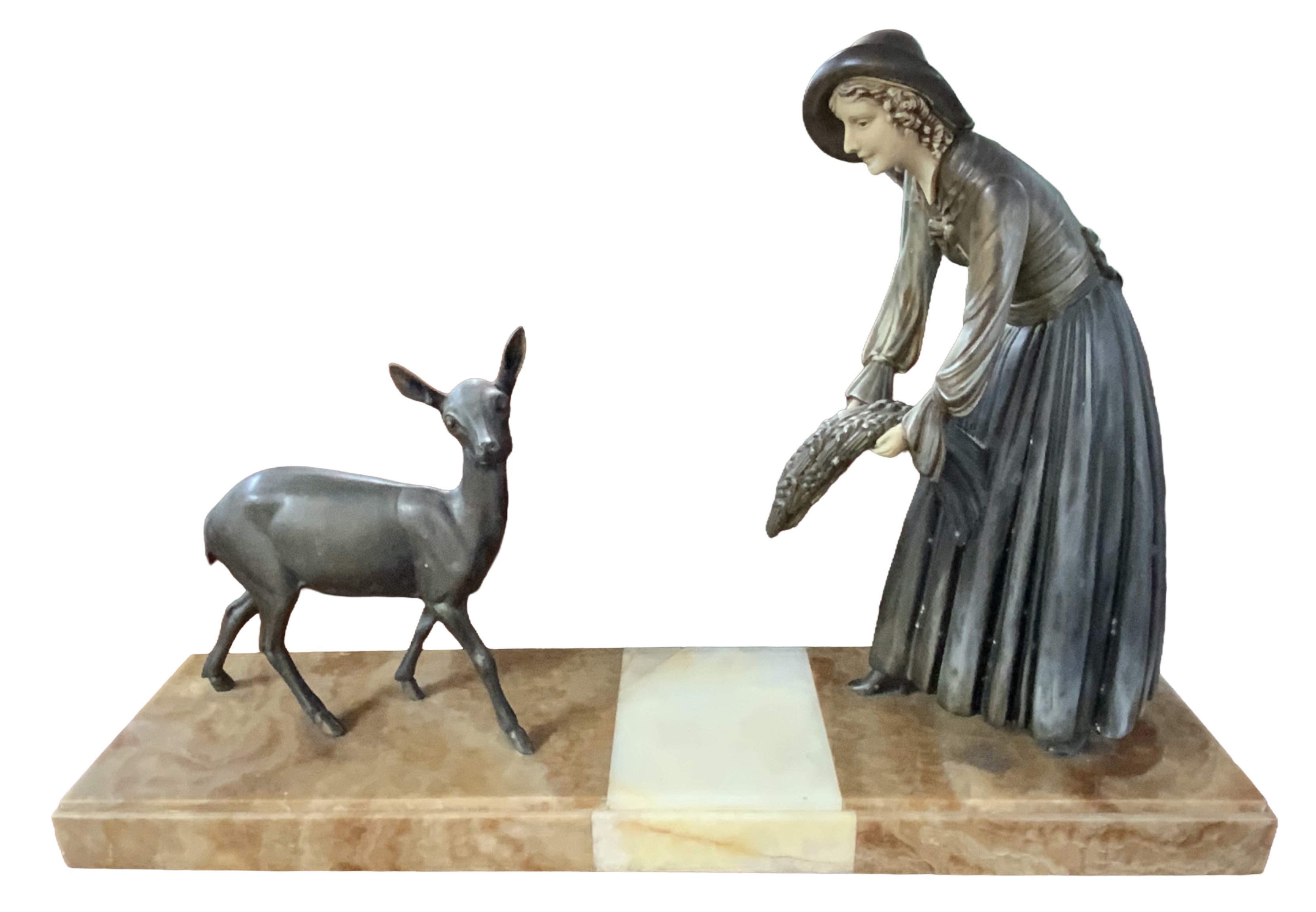 A art deco spelter figure of a lady feeding a fawn mounted on a large alabaster base. 68cm x 44cm x 17cm