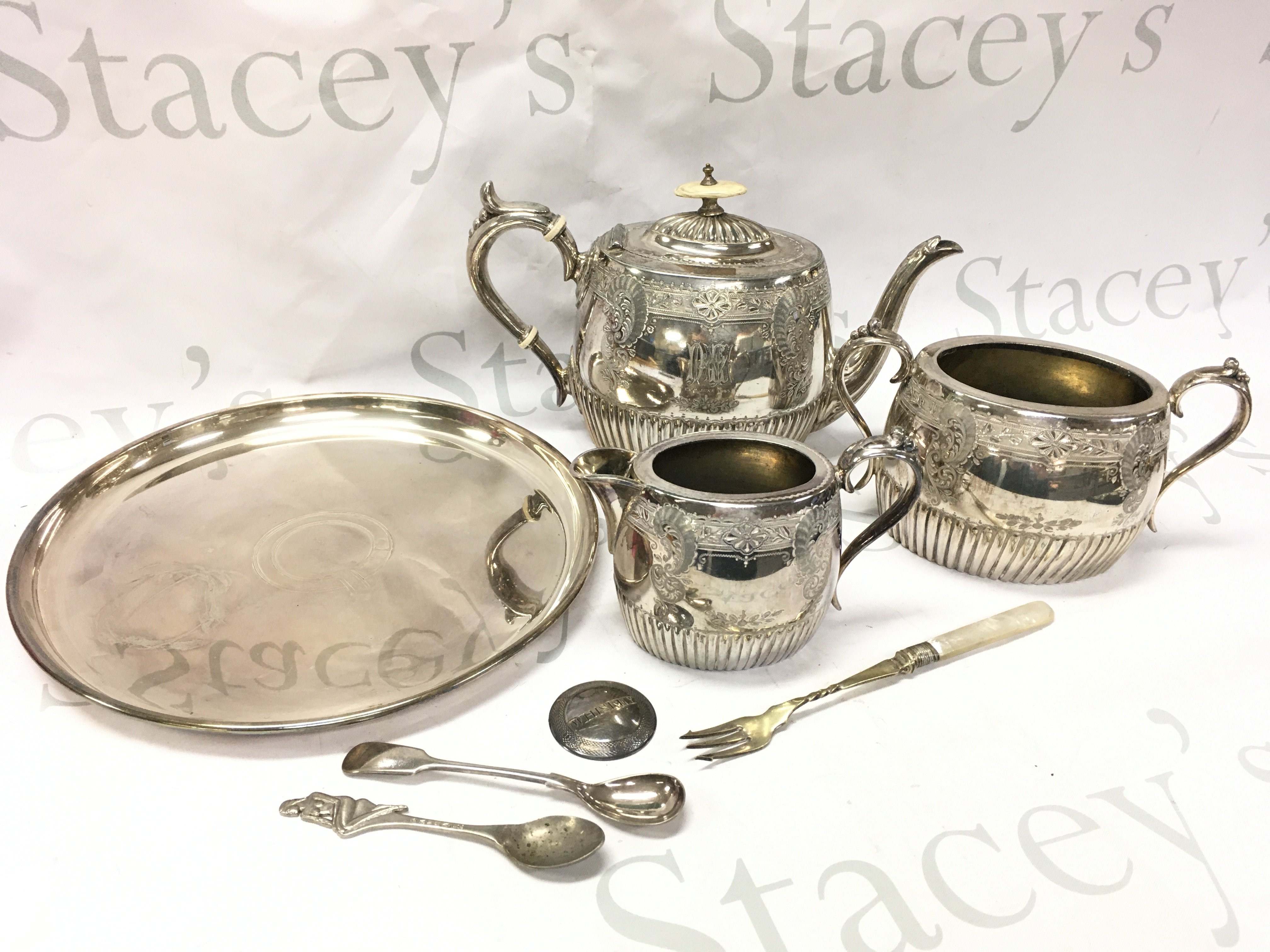 Silver plated items including a three piece tea set dated 1883, Joseph Rodgers & Sons dish, cutlery pieces. Postage category B