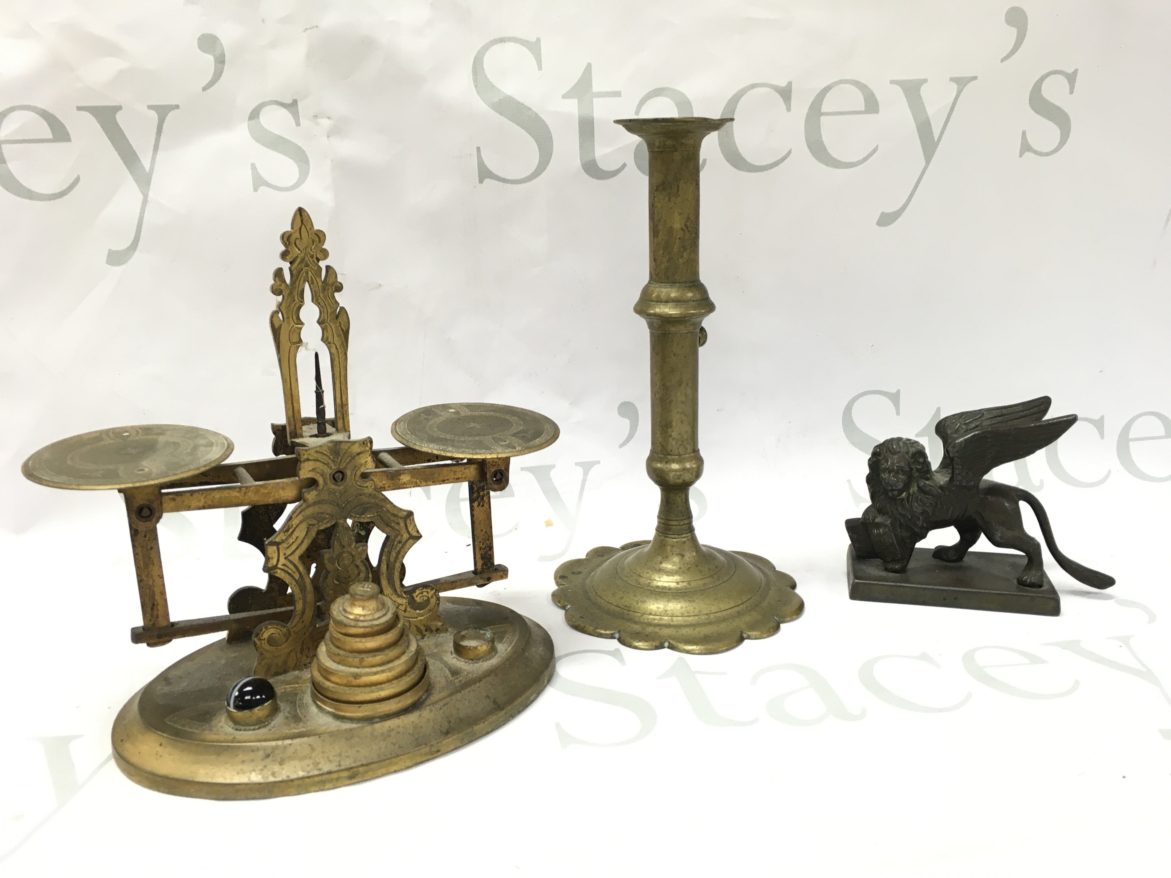 Small set of Victorian scales , small winged lion bronze and a late 18th century brass candle stick . Postage category B
