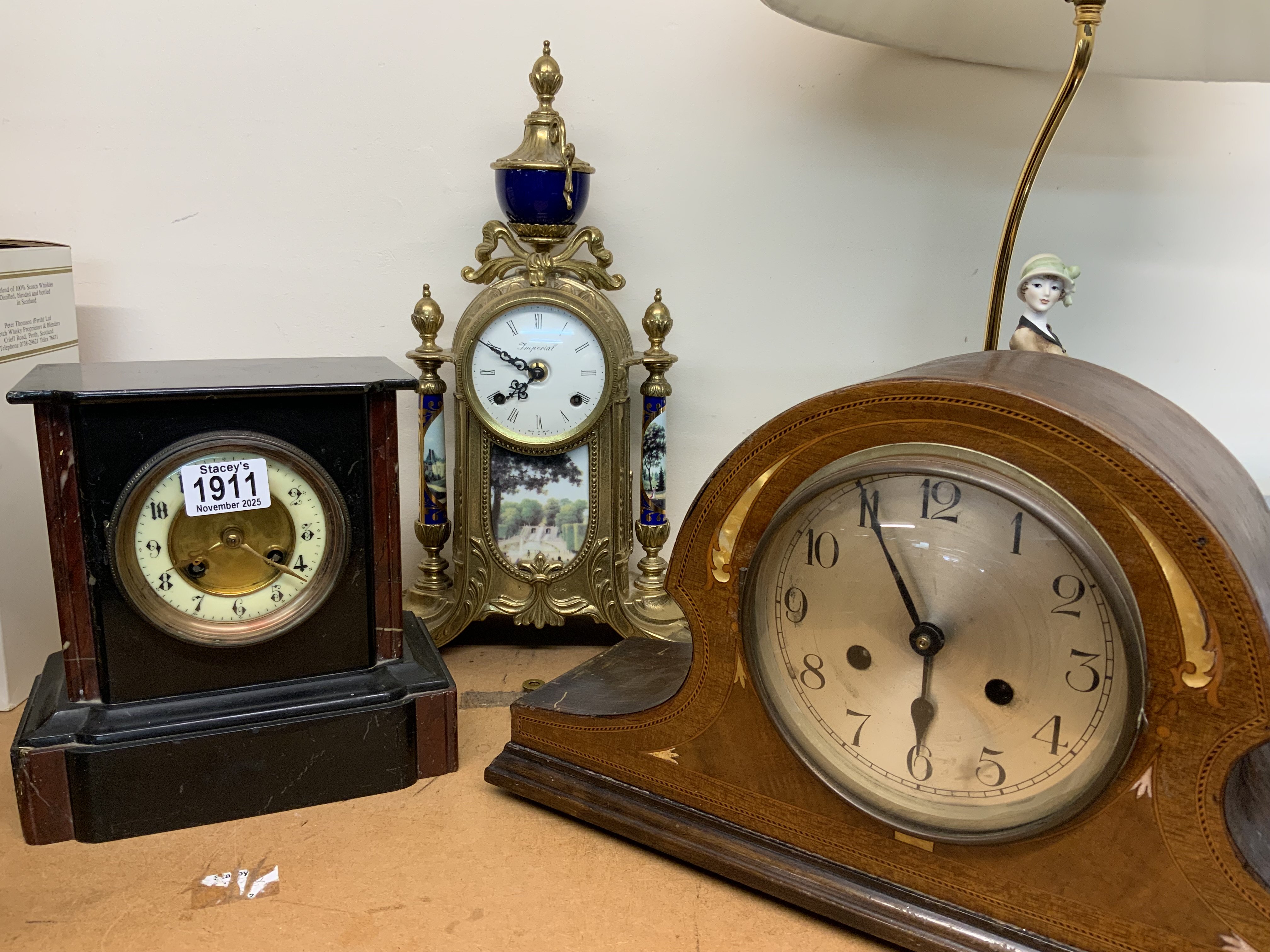 3 vintage mantle clocks of various forms.