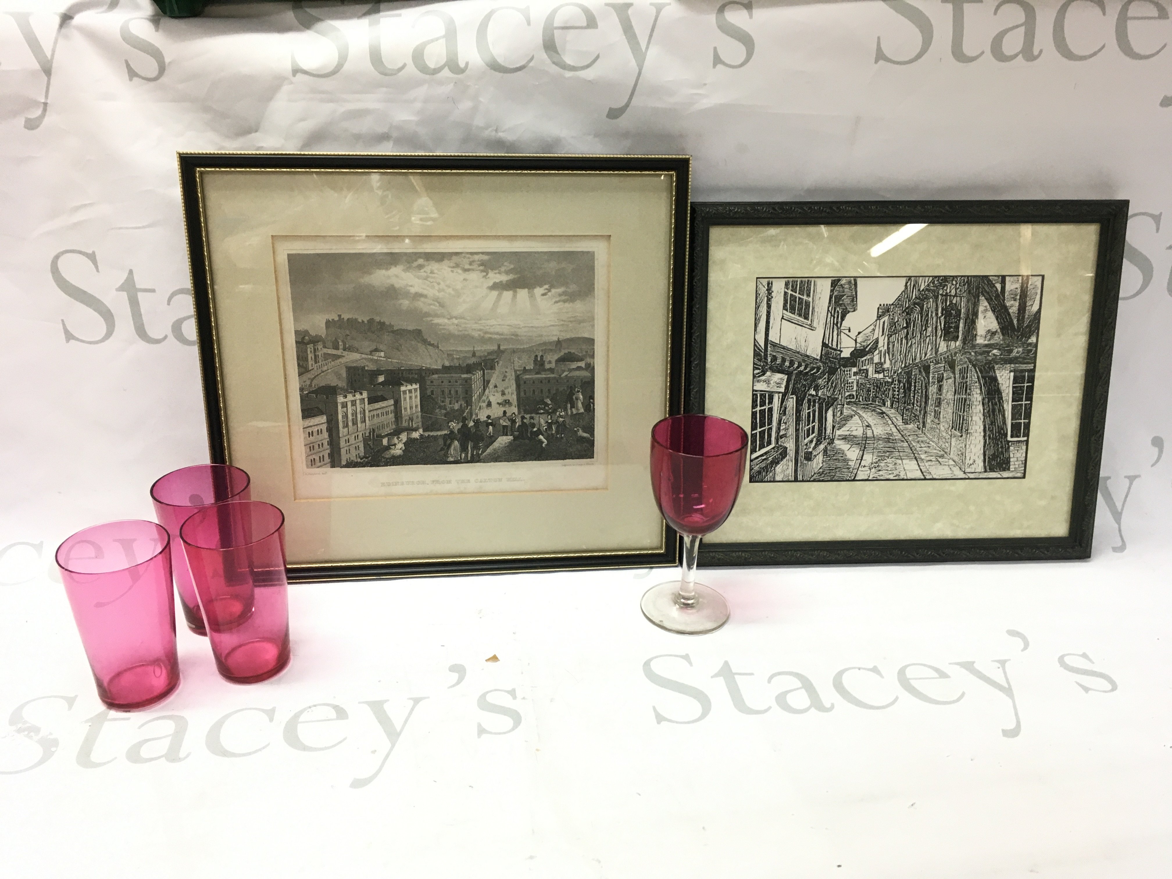 Four cranberry glasses, Framed Edinburgh engraving , From the Carlton Hill and a framed print The Shables in York. This lot cannot be posted
