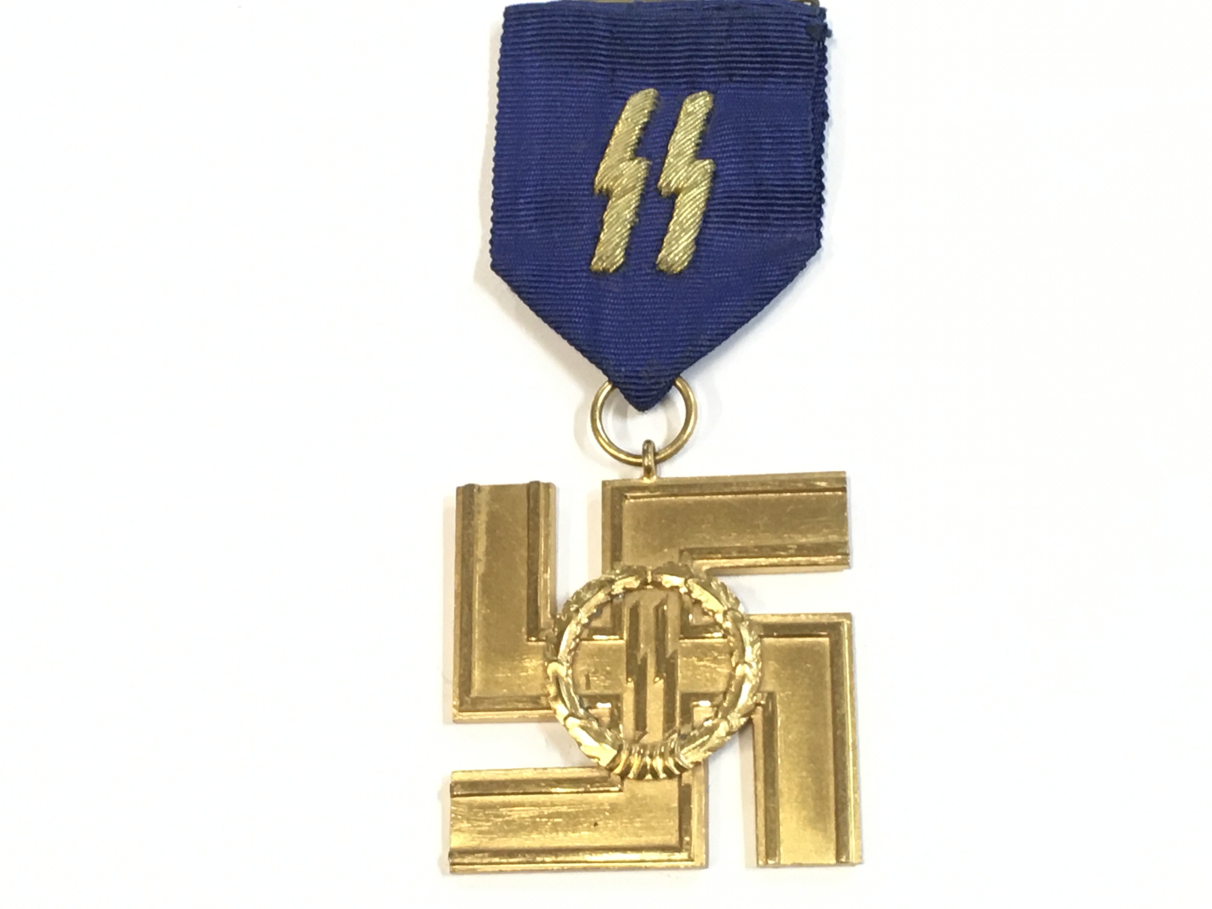 A German Third Reich SS 25 year gilt service medal (Rudolf Souval) . Postage cat a