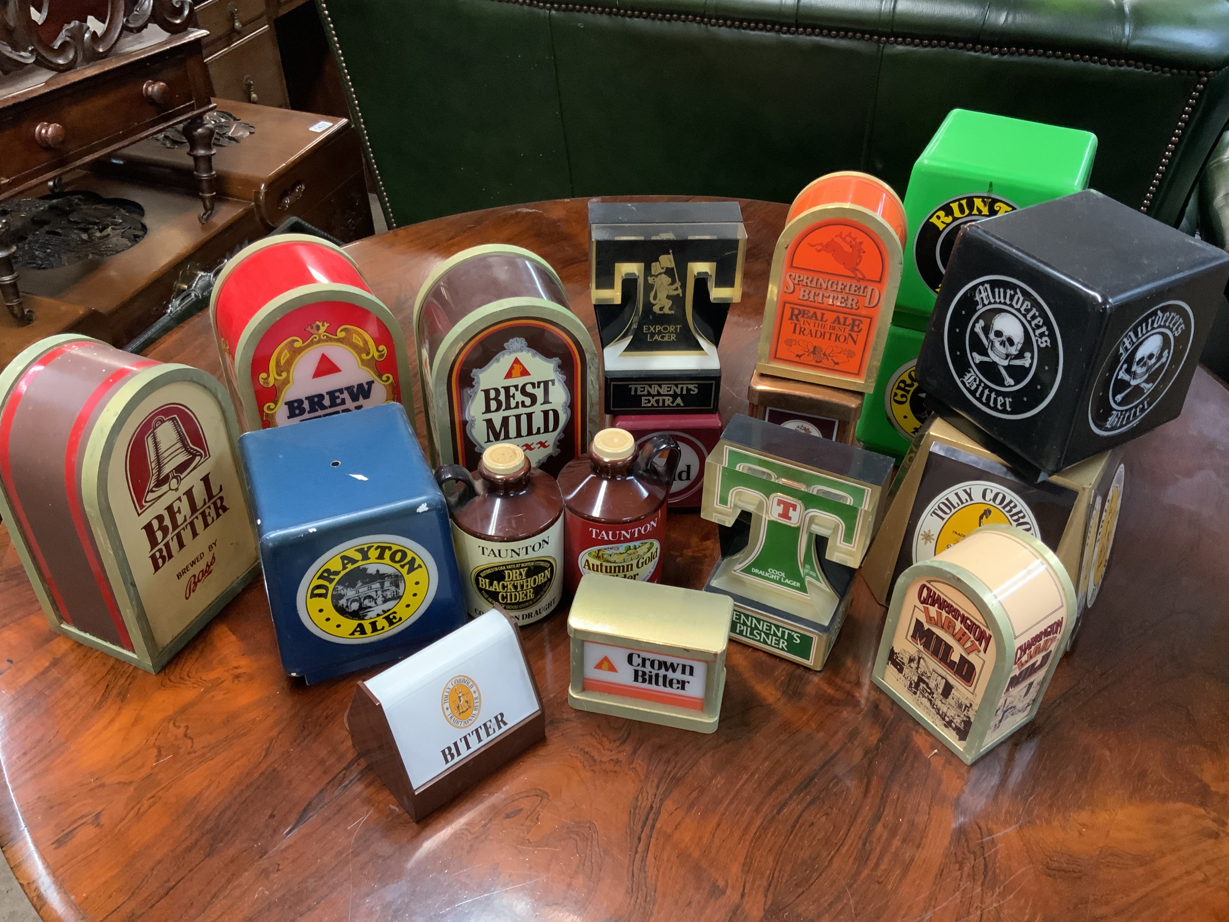 A collection of small vintage bar tap lights.